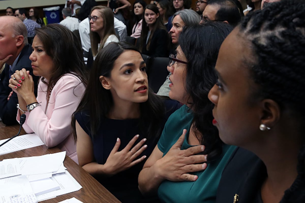 WASHINGTON, DC - JULY 12: U.S. Rep. Alexandria Ocasio-Cortez (D-NY) (3R) speaks with Rep. Rashida Tlaib (D-MI) (2R) as U.S. Rep. Veronica Escobar (D-TX) (4R) and Rep. Ayanna S. Pressley (D-MA) (R) look on during a House Oversight and Reform Committee holds a hearing on "The Trump Administration's Child Separation Policy: Substantiated Allegations of Mistreatment." July 12, 2019 in Washington, DC. The hearing comes just ahead of a planned multiday Immigration and Customs Enforcement (ICE) operation to arrest thousands of undocumented immigrant families in several cities across the U.S. (Photo by Win McNamee/Getty Images)