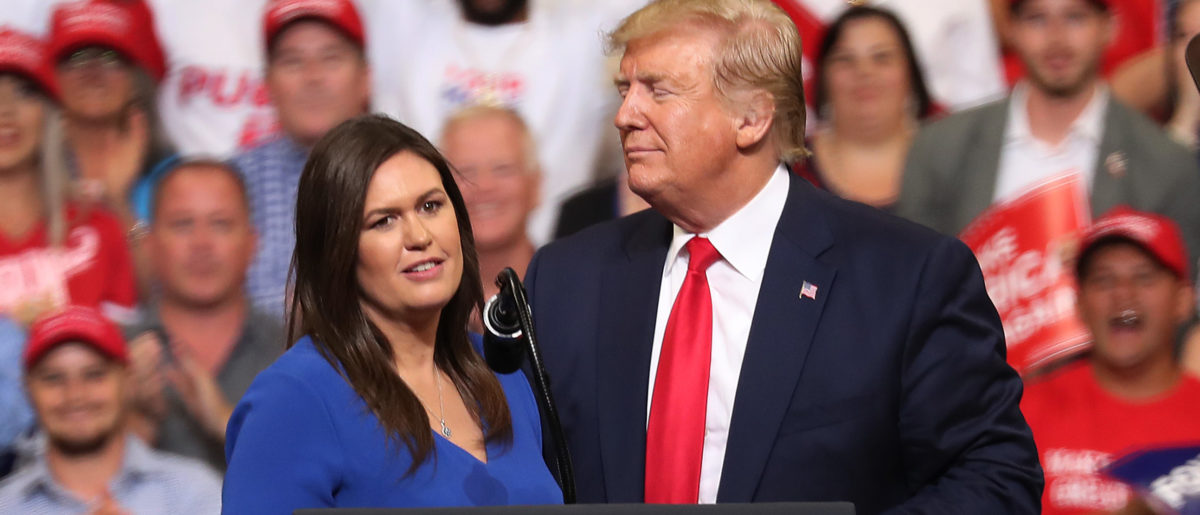 President Donald Trump stands with Sarah Huckabee Sanders, who announced that she is stepping down as the White House press secretary. (Joe Raedle/Getty Images)