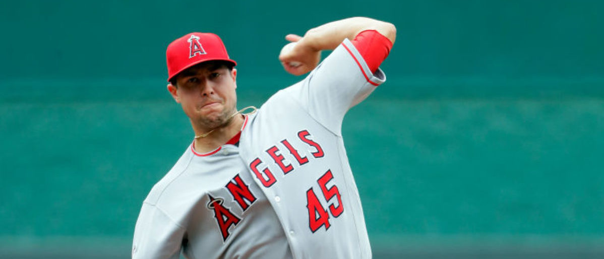 Los Angeles Angels bring Tyler Skaggs' jersey onto the field and wear his  #45 as they pay tribute