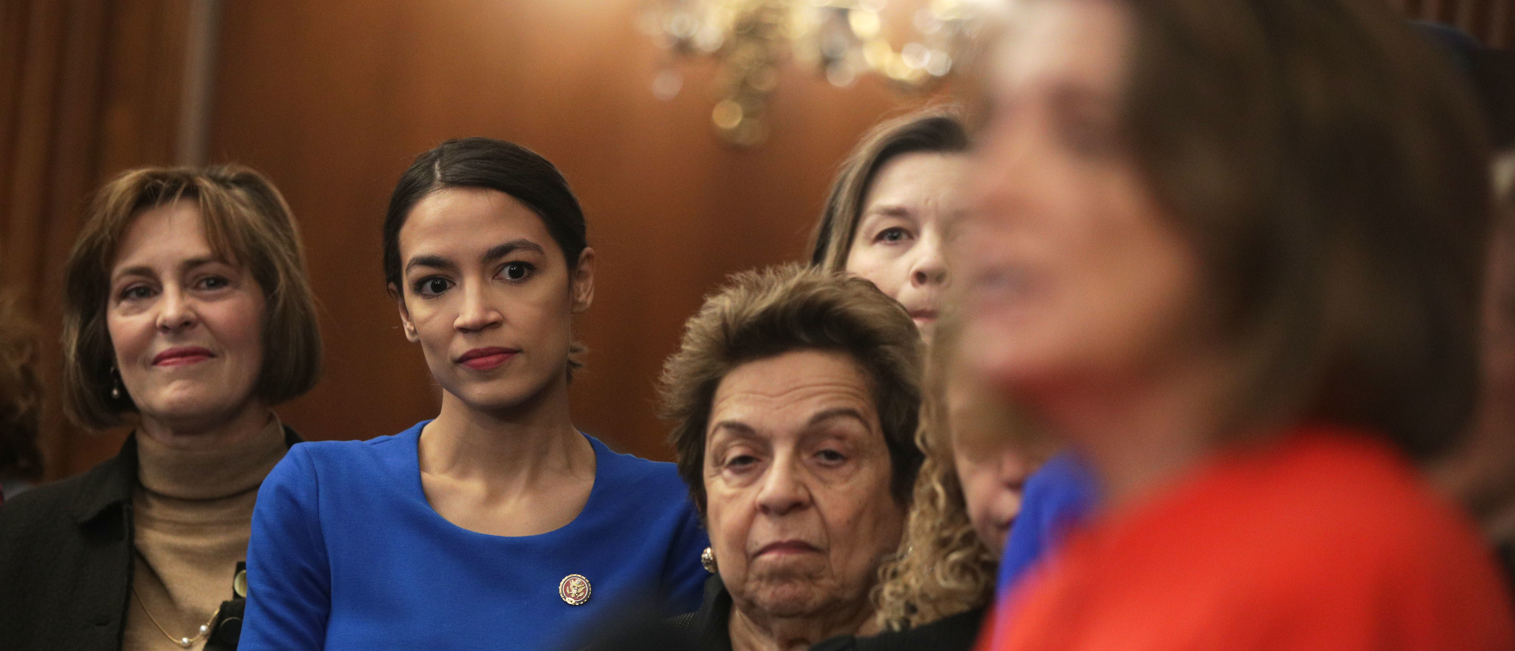 WASHINGTON, DC - JANUARY 30: (L-R) U.S. Rep. Kathy Castor (D-FL), Rep. Alexandria Ocasio-Cortez (D-NY), and Rep. Donna Shalala (D-FL) listen as Speaker of the House Rep. Nancy Pelosi (D-CA) speaks during a news conference at the U.S. Capitol January 30, 2019 in Washington, DC. House Democrats held a news conference to introduce the "Paycheck Fairness Act." (Photo by Alex Wong/Getty Images)