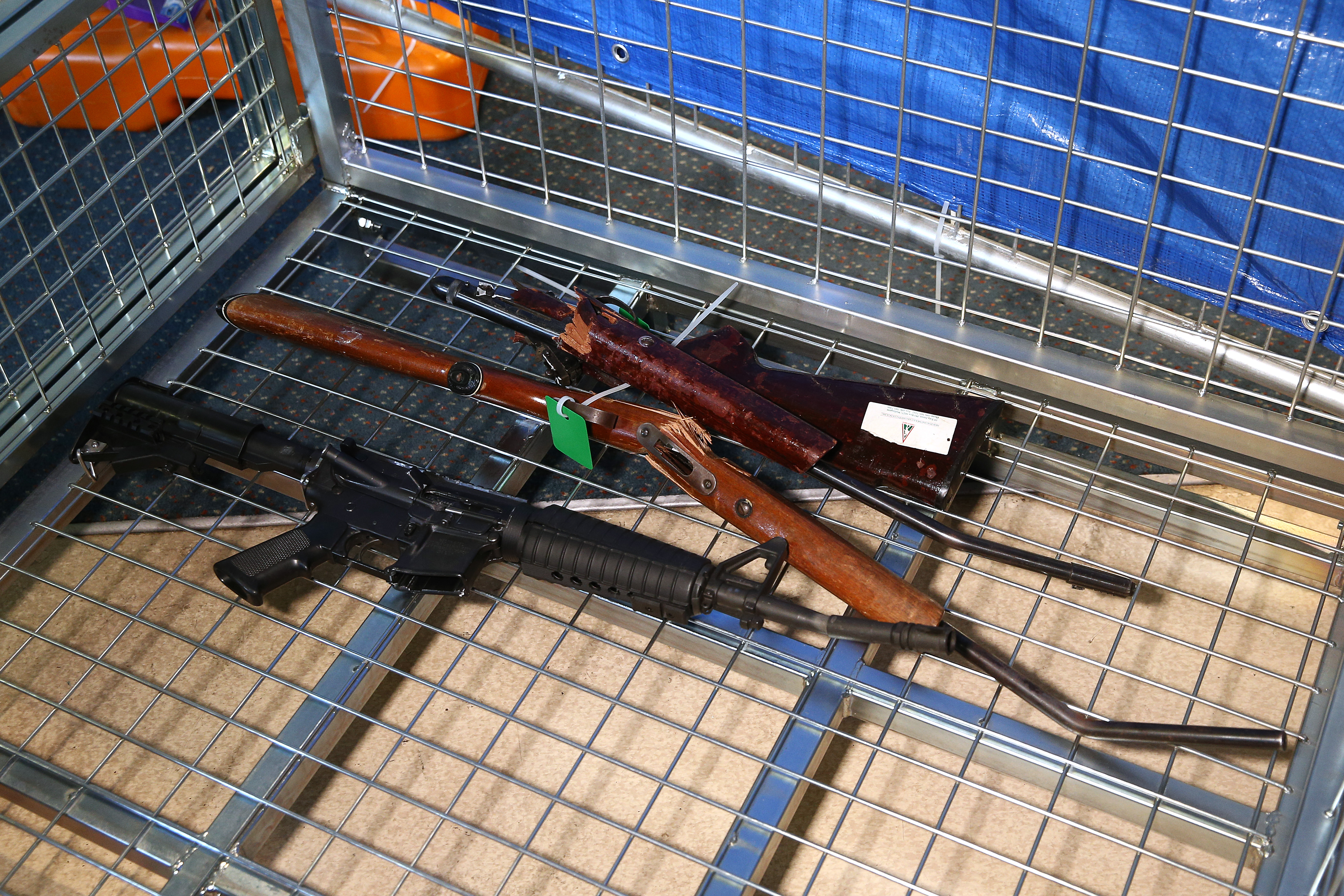 Guns lie in a container during a firearm buy-back collection event on July 04, 2019 in Wellington, New Zealand. New Zealand gun owners will be able to hand in their guns around the country during the buy back and amnesty period starting from 13 July. The NZ Government will pay owners between 25 per cent and 95 per cent of a set base price, depending on condition. It will also compensate dealers and pay for some weapons to be modified to make them legal. The amnesty ends on December 20. (Photo by Hagen Hopkins/Getty Images)