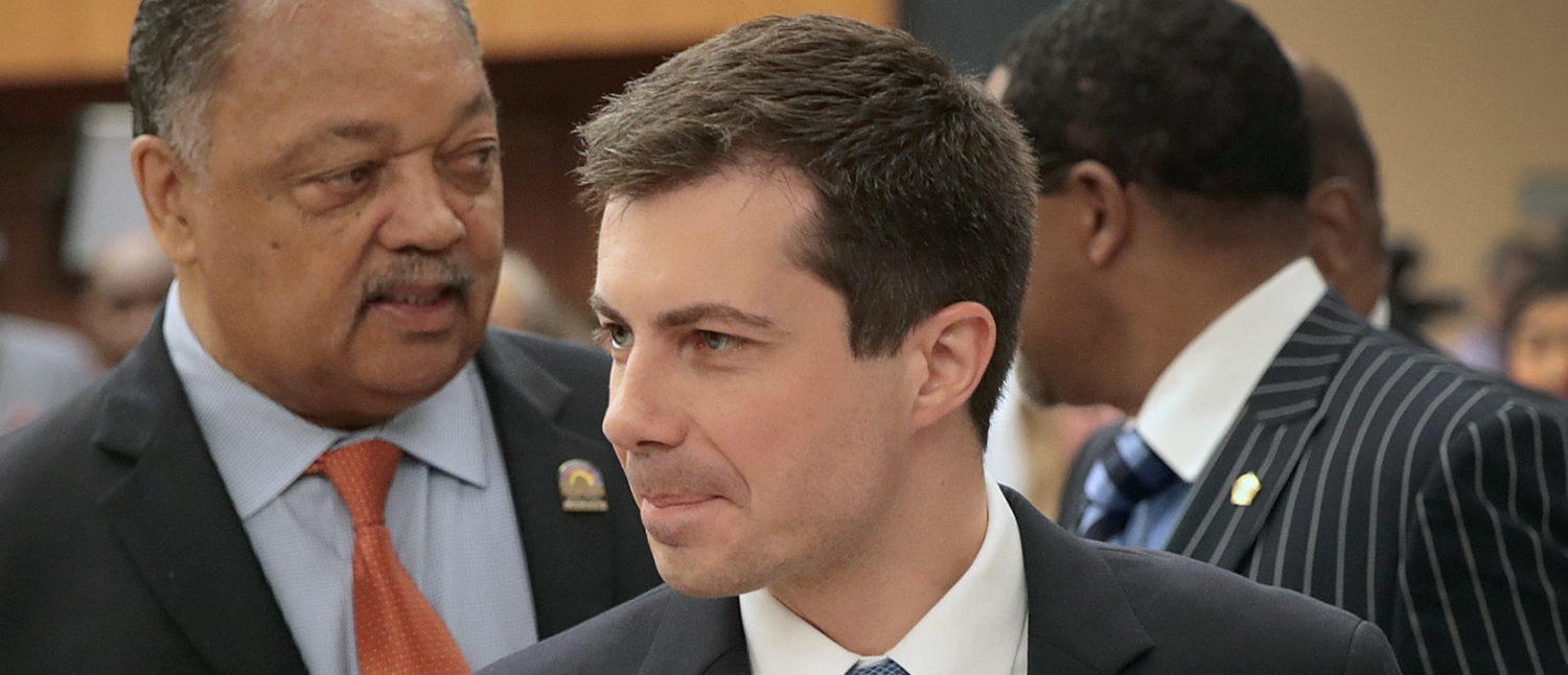 Democratic presidential candidate and South Bend, Indiana mayor Pete Buttigieg (L) meets with Rev. Jesse Jackson at the Rainbow PUSH Coalition Annual International Convention on July 2, 2019 in Chicago, Illinois. (Photo by Scott Olson/Getty Images)