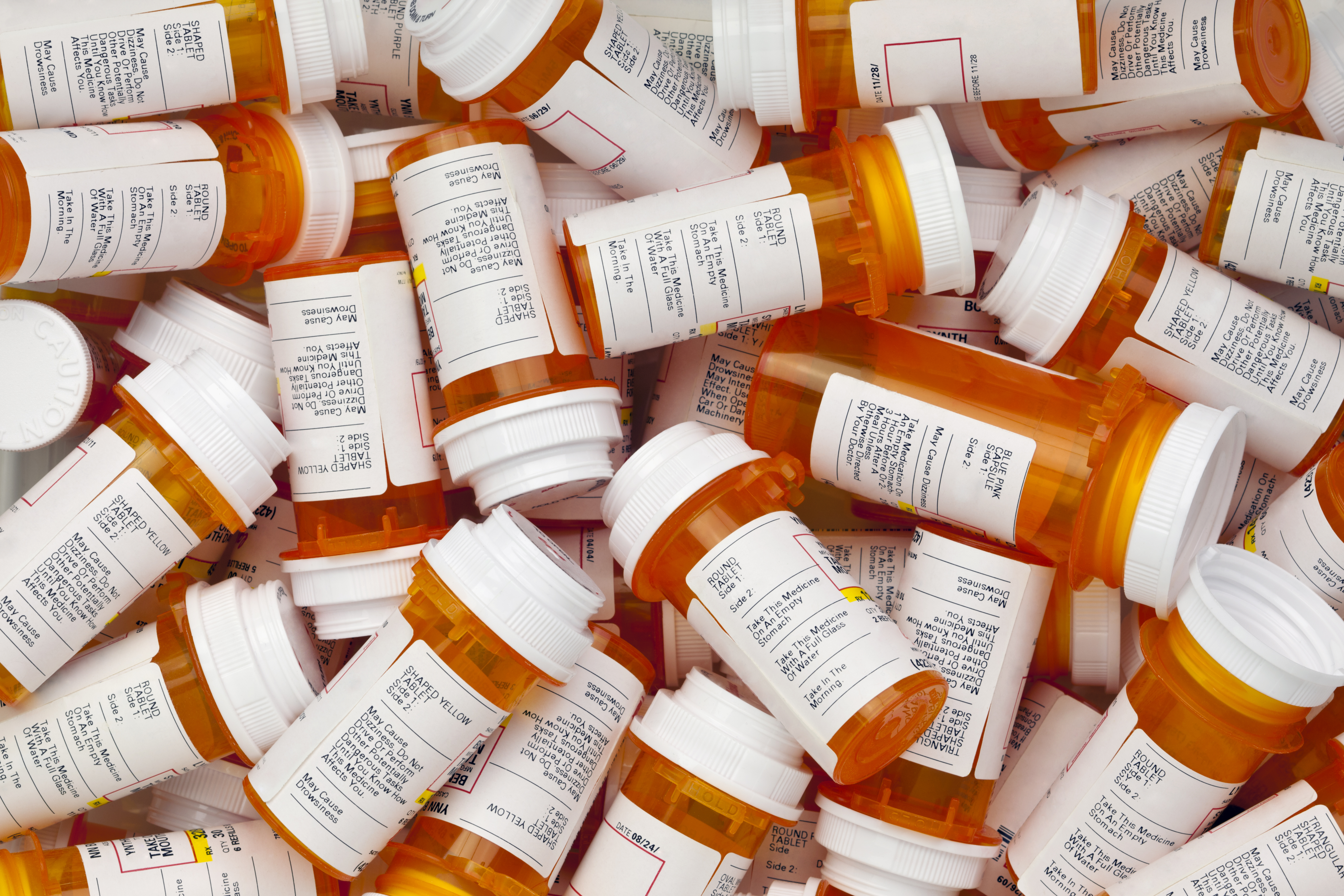 Prescription bottles are in a jumble. Shutterstock image via David Smart