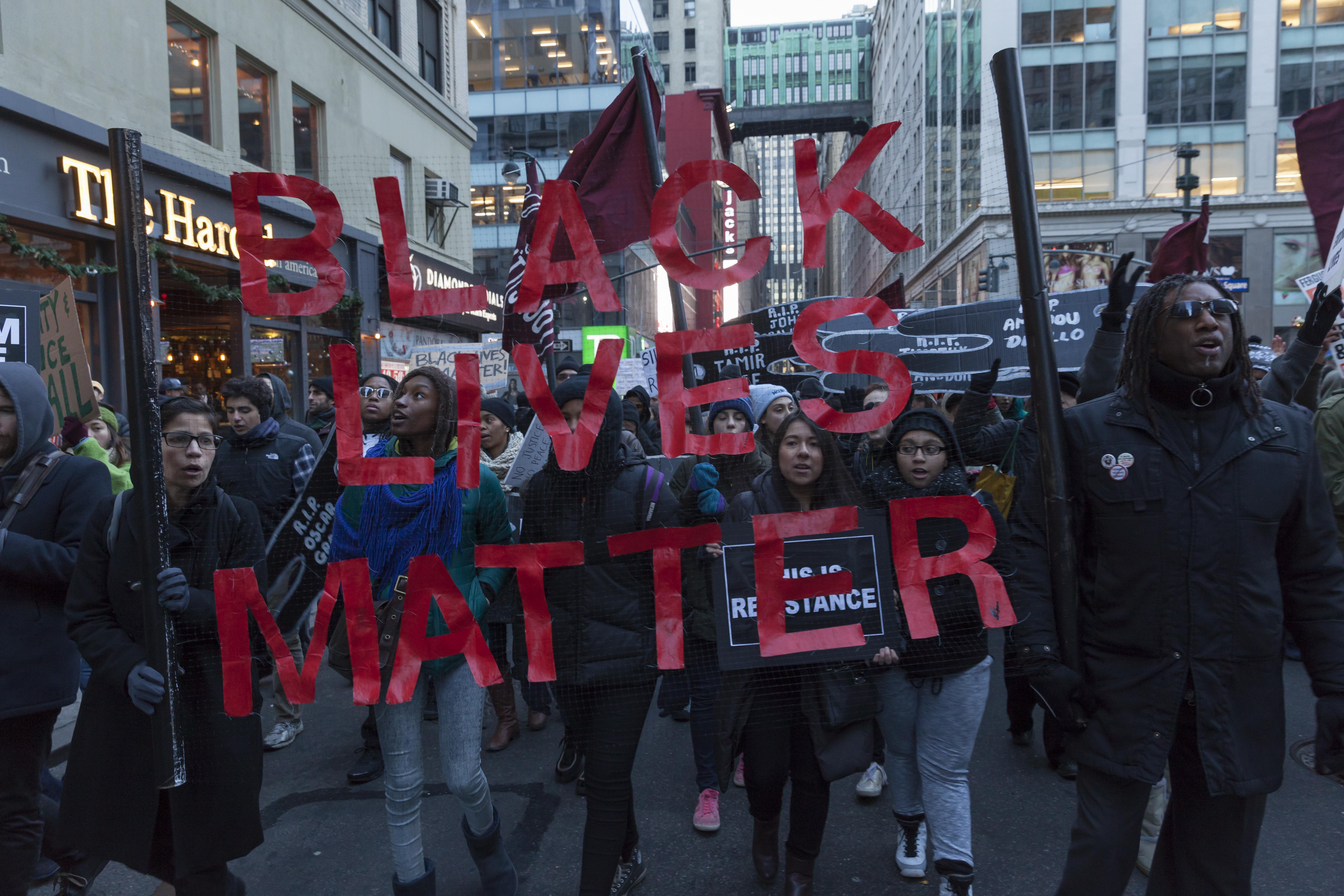 New York, NY USA - December 13, 2014: Protesters march against police brutality and grand jury decision on Eric Garner case on Broadway and 32nd street (Shutterstock)