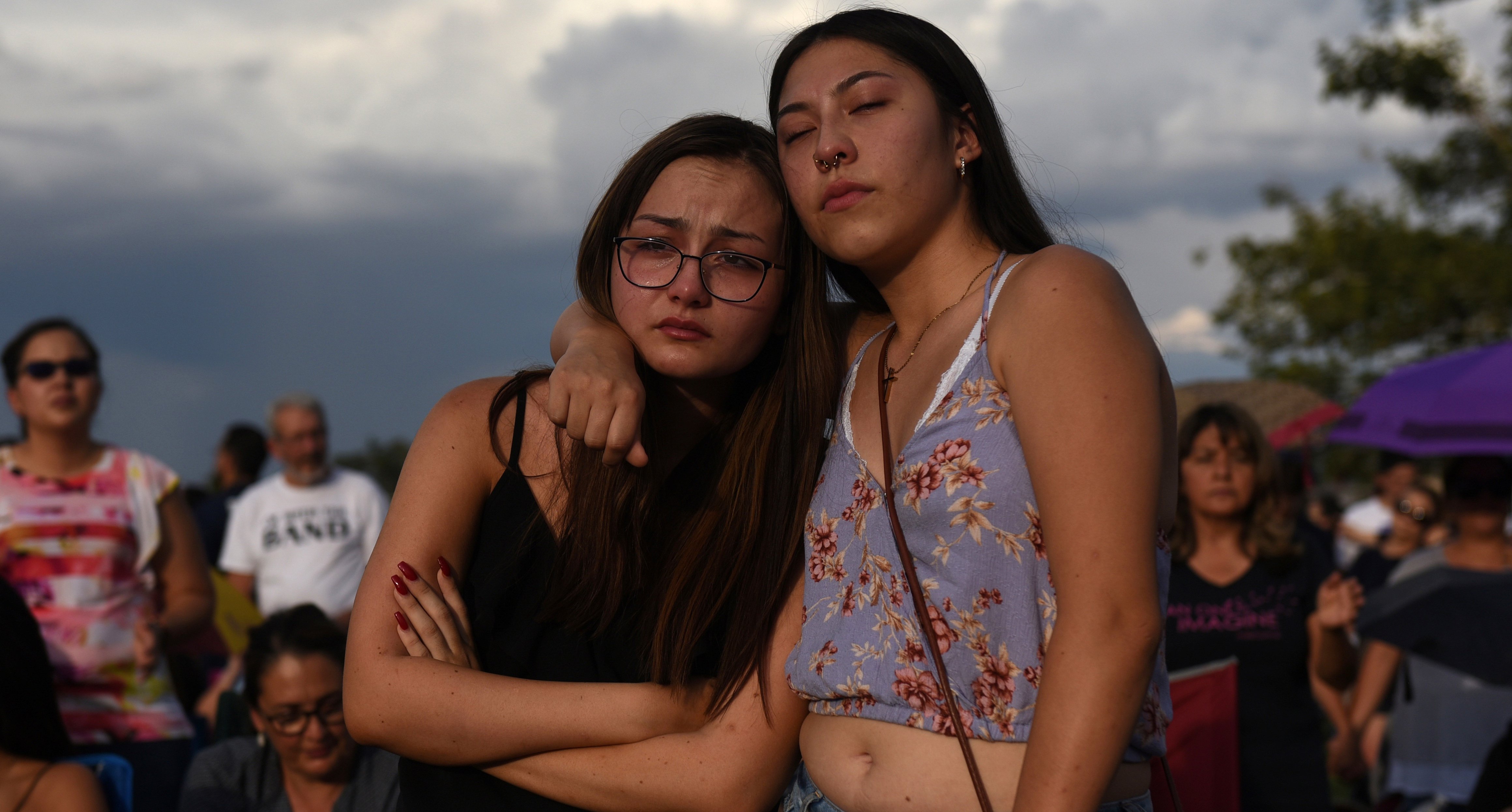 Amber Ruiz and Jazmyn Blake embrace during a vigil a day after a mass shoot...