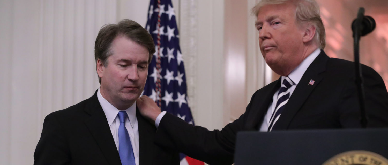 WASHINGTON, DC - OCTOBER 08: U.S. President Donald Trump (R) puts his hand on Supreme Court Associate Justice Brett Kavanaugh's shoulder during his ceremonial swearing in in the East Room of the White House October 08, 2018 in Washington, DC. Kavanaugh was confirmed in the Senate 50-48 after a contentious process that included several women accusing Kavanaugh of sexual assault. Kavanaugh has denied the allegations. (Photo by Chip Somodevilla/Getty Images)