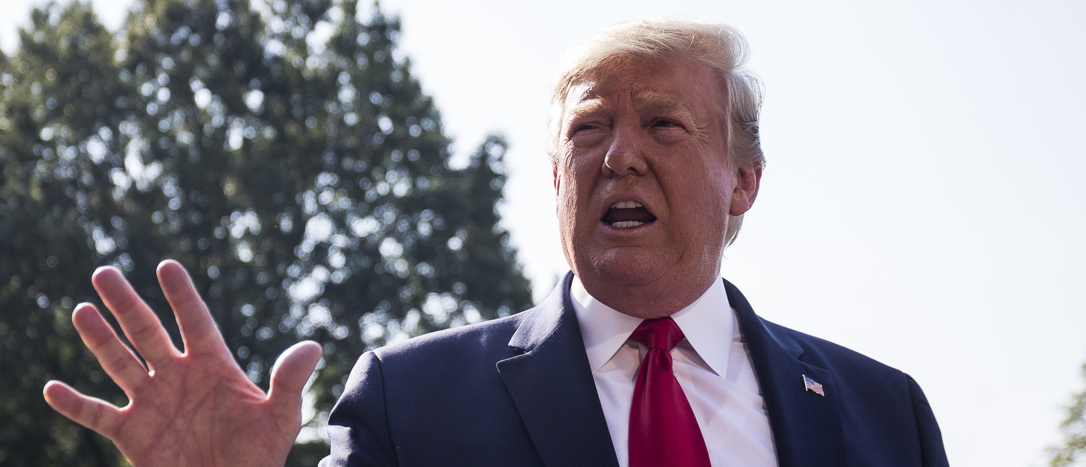 President Donald Trump speaks to members of the press before departing from the White House en route to Dayton, Ohio and El Paso, Texas on August 7, 2019. (Zach Gibson/Getty Images)