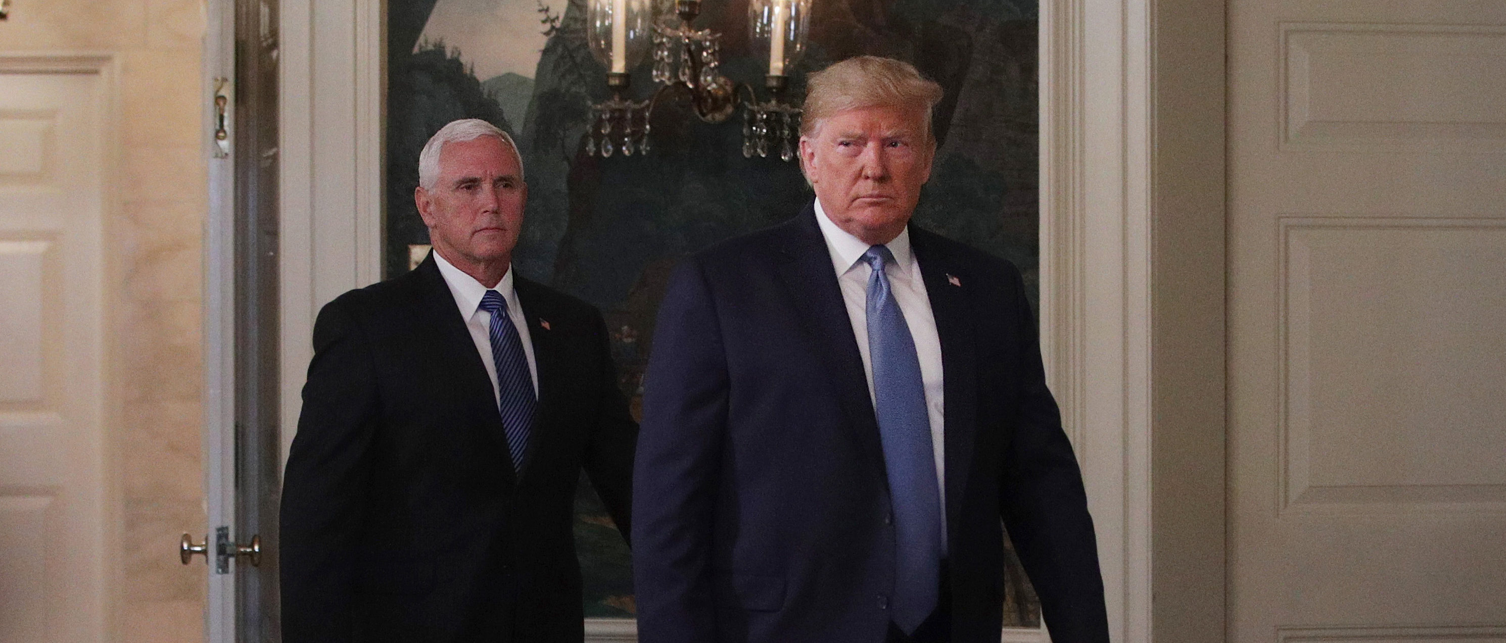 WASHINGTON, DC - AUGUST 05: U.S. President Donald Trump and Vice President Mike Pence enter the Diplomatic Reception Room of the White House to make remarks August 5, 2019 in Washington, DC. President Trump delivered remarks on the mass shootings in El Paso, Texas, and Dayton, Ohio, over the weekend. (Photo by Alex Wong/Getty Images)