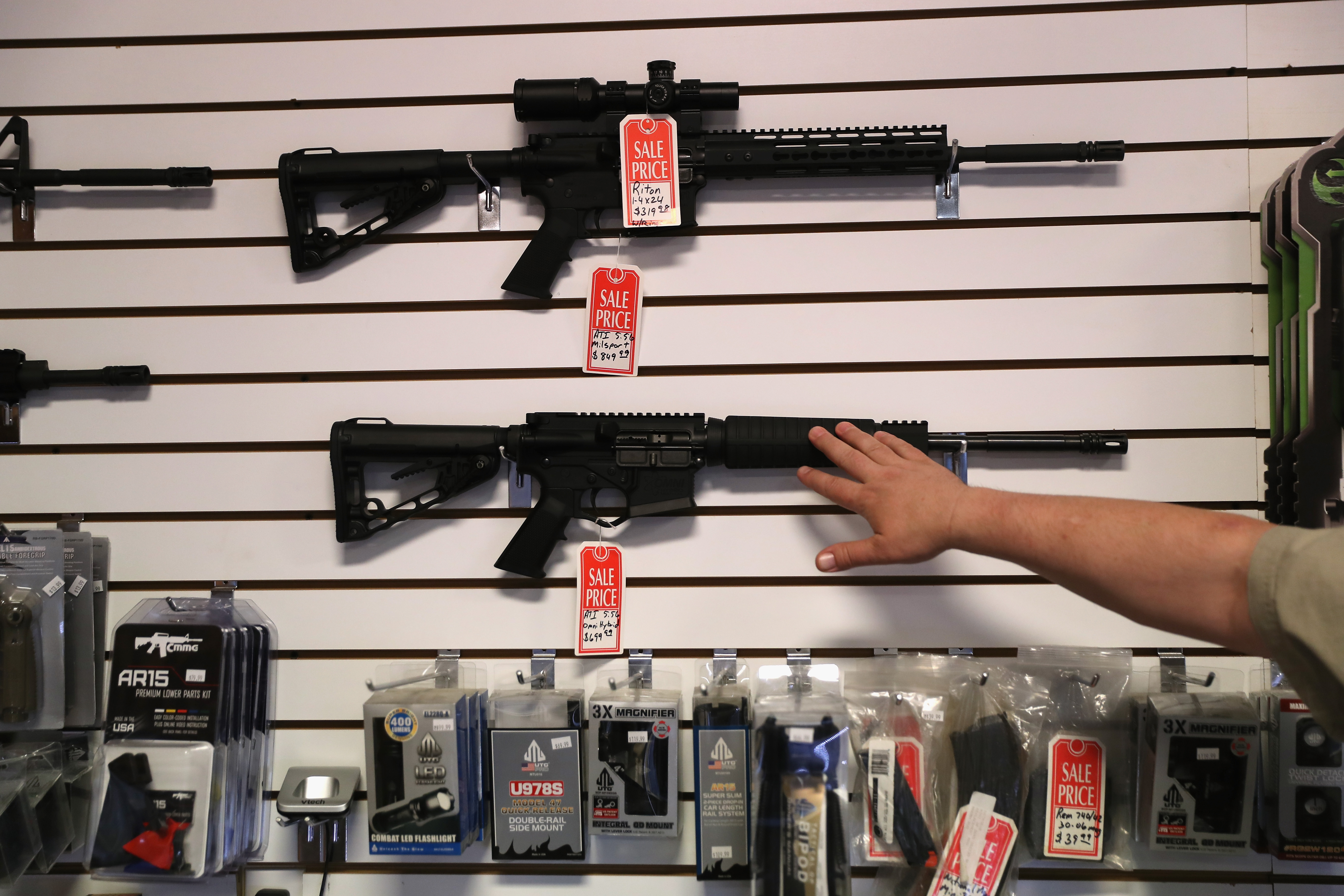 BENSON, AZ - SEPTEMBER 29: Gun shop owner Jeff Binkley displays AR-15 "Sport" rifles at Sarge's Sidearms on September 29, 2016 in Benson, Arizona. He said he redesigned and renamed his store just this year. Gun shops are proliferate in Arizona, which regulates and restricts weapons less than anywhere in the United States. (Photo by John Moore/Getty Images)