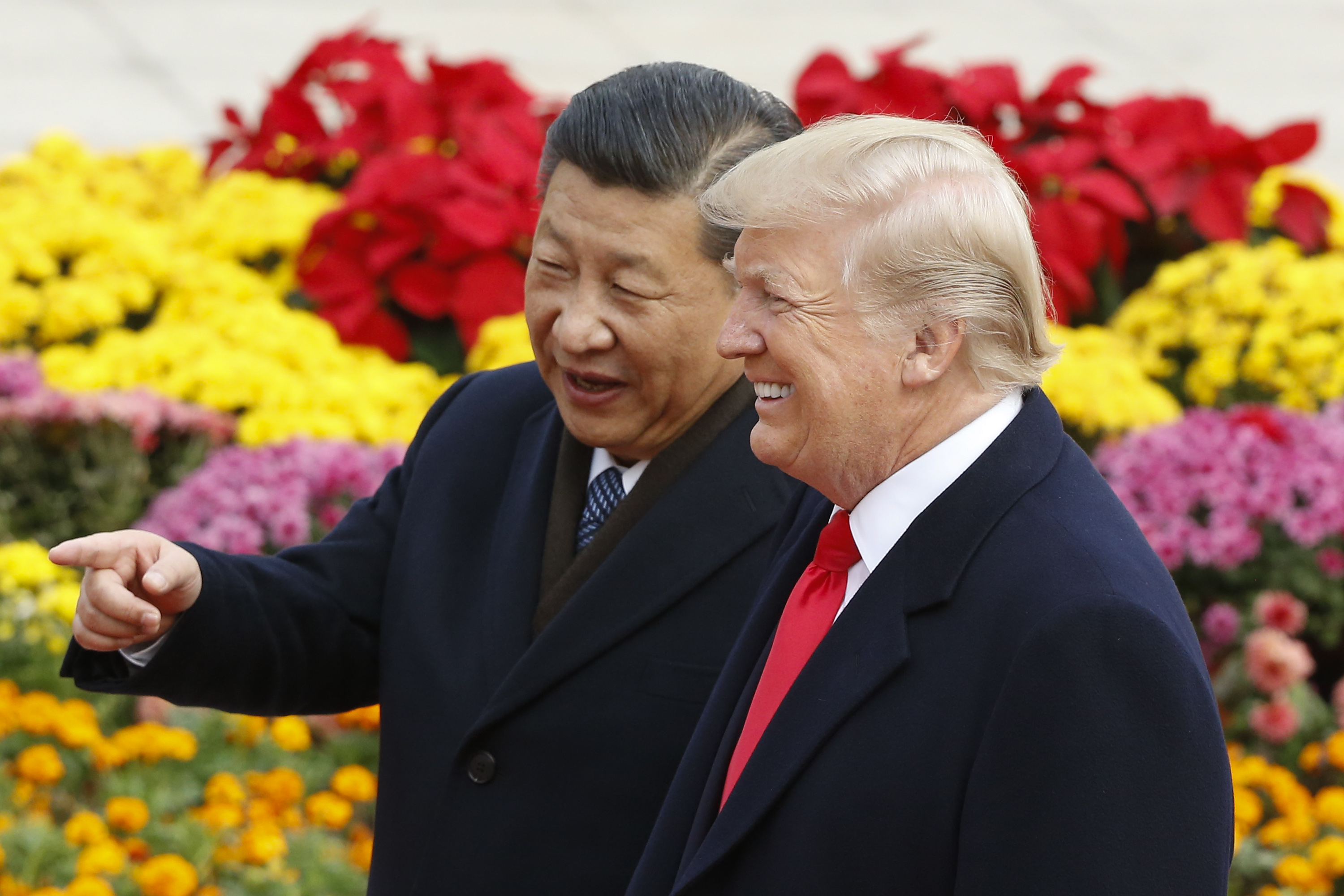Chinese President Xi Jinping and U.S. President Donald Trump attend a welcoming ceremony November 9, 2017 in Beijing, China. Trump is on a 10-day trip to Asia. (Photo by Thomas Peter-Pool/Getty Images)