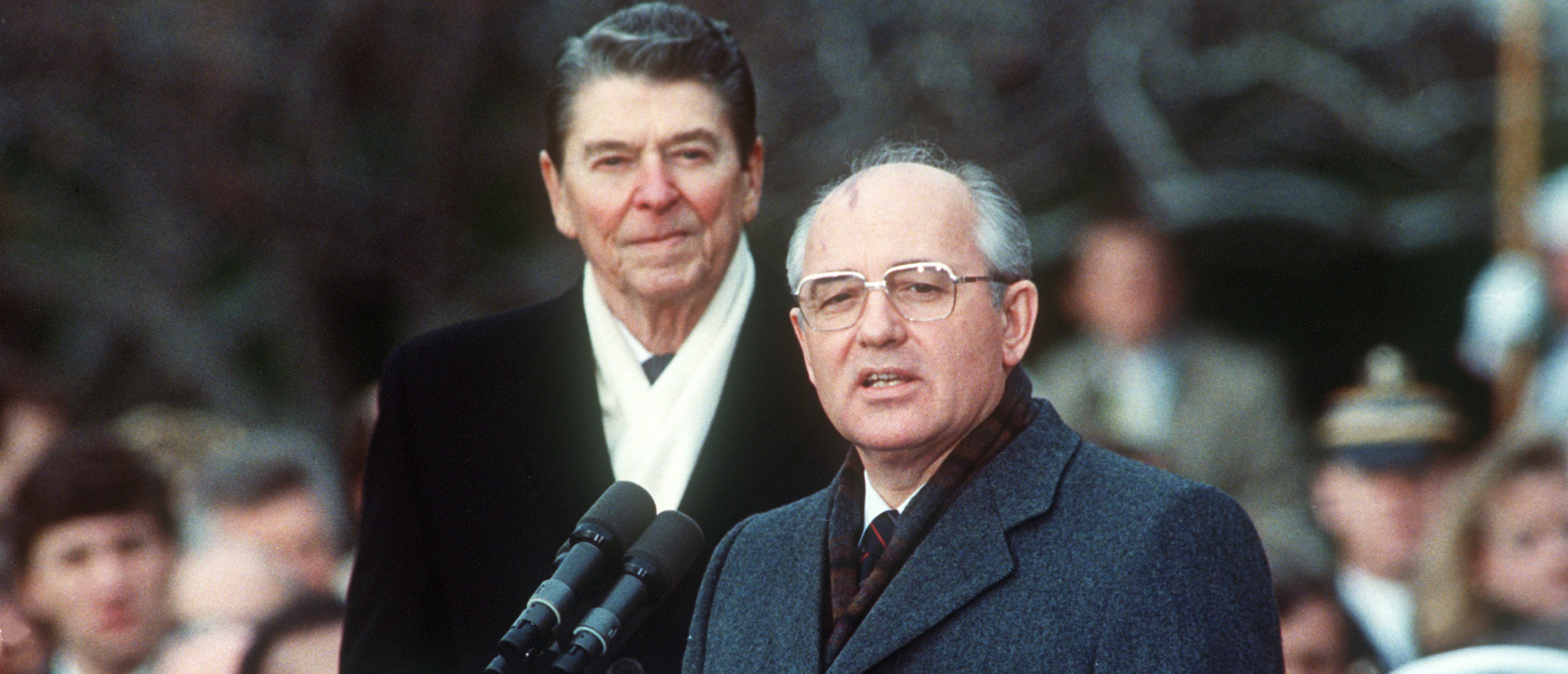 This December 1987 photo shows U.S. President Ronald Reagan (L) with Soviet leader Mikhail Gorbachev during welcoming ceremonies at the White House on the first day of their disarmament summit. (Photo: AFP PHOTO / JEROME DELAY/Getty Images)