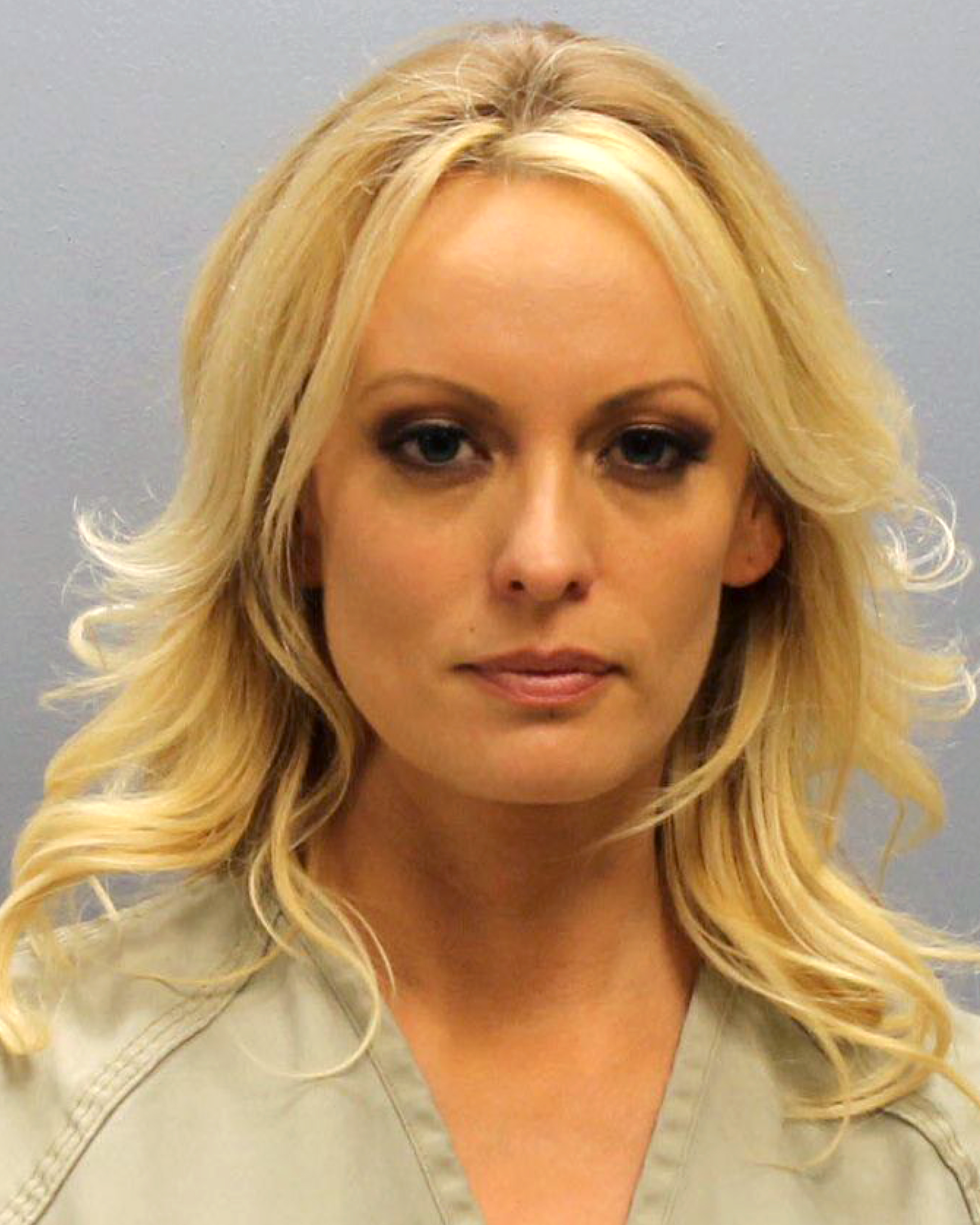 In this handout provided by Franklin County Sheriff's Office, adult film actress Stephanie Clifford aka Stormy Daniels poses for a mugshot photo after being arrested at an Ohio strip club for allegedly touching three undercover detectives during her performance in violation of state law July 12, 2018 in Columbus, Ohio. (Photo by Franklin County Sheriff's Office via Getty Images)