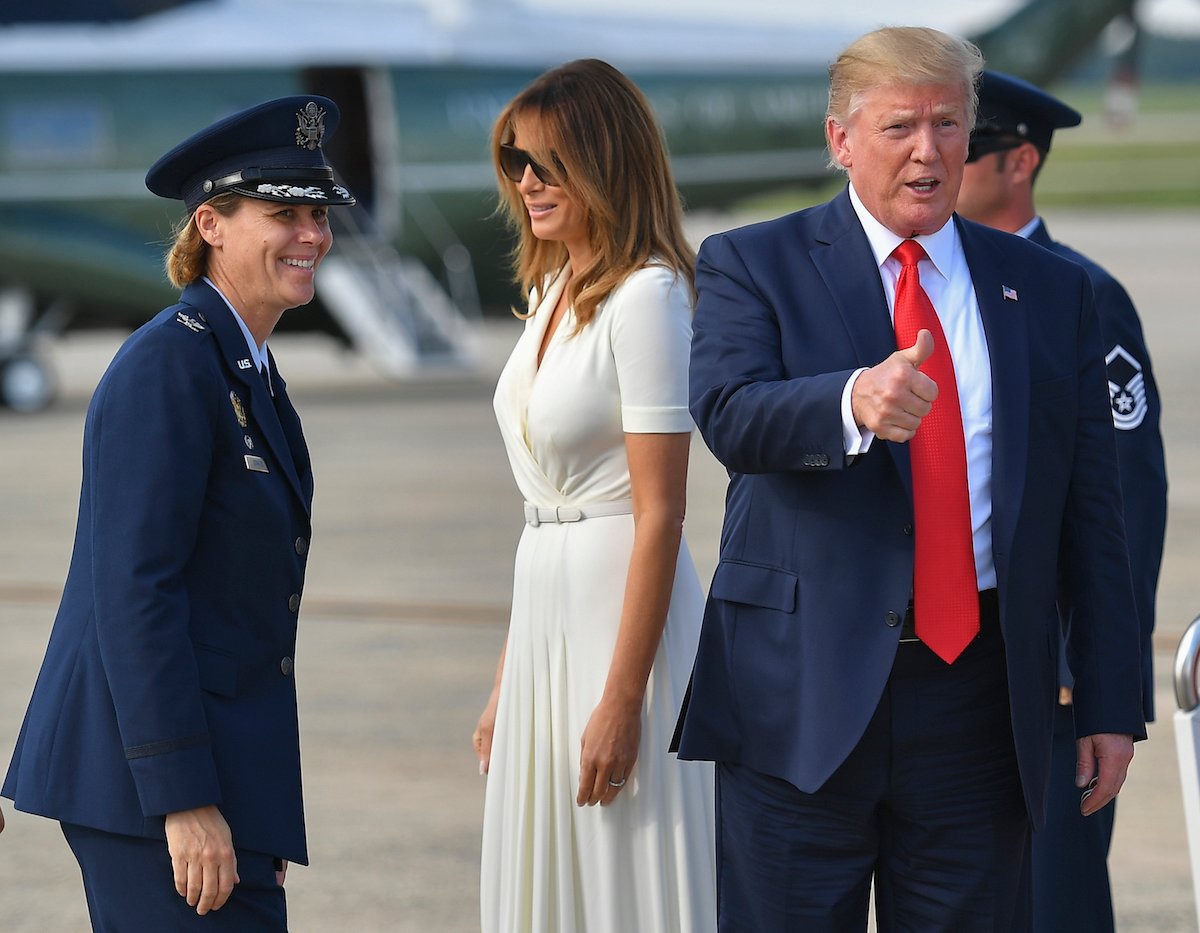 US President Donald Trump and First Lady Melania Trump make their way to board Air Force One before departing from Morristown Municipal Airport in Morristown, New Jersey on July 7, 2019. - Trump is returning to Washington after spending the weekend at his Bedminster golf resort. (Photo credit: MANDEL NGAN/AFP/Getty Images)