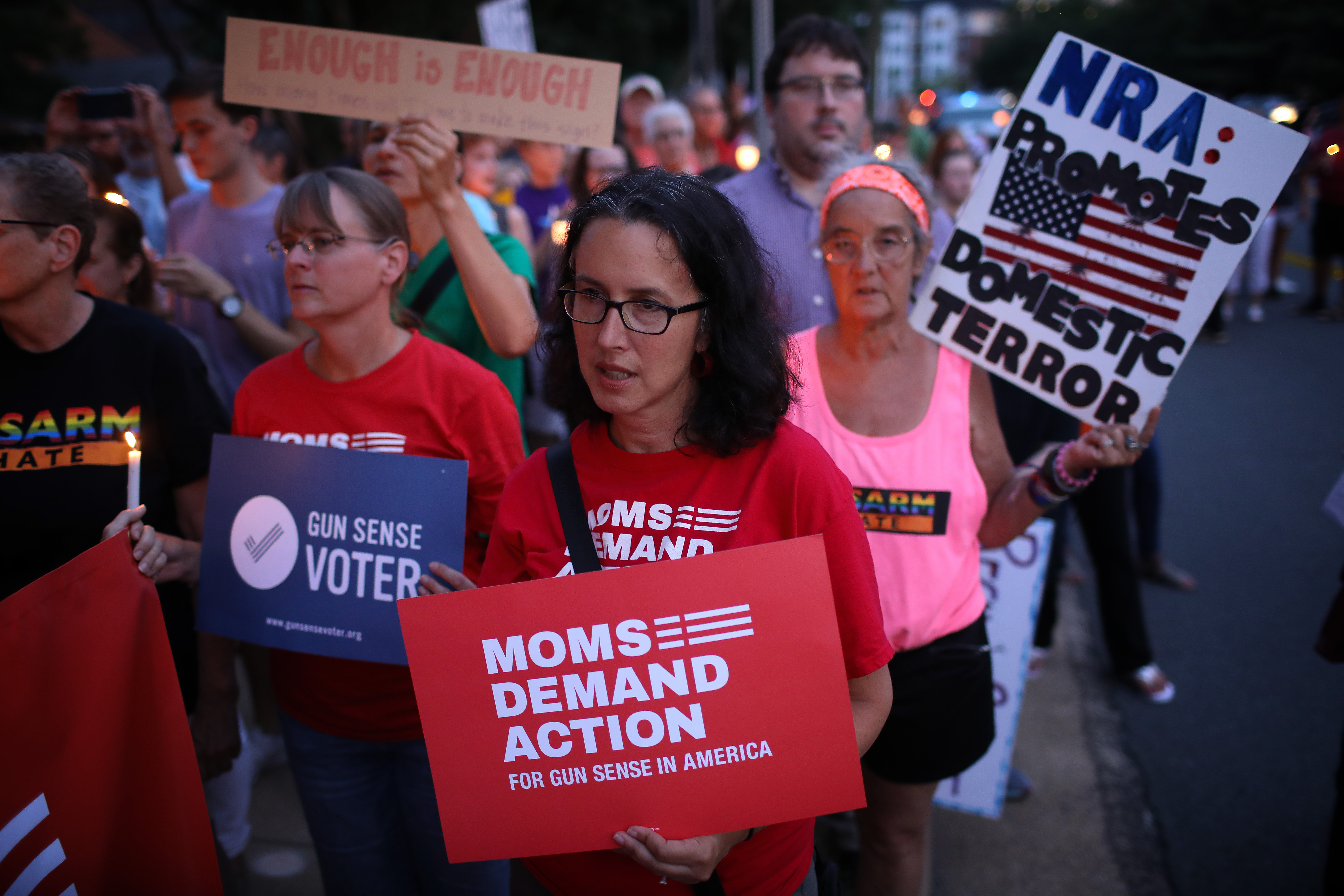 FAIRFAX, VIRGINIA - AUGUST 05: Advocates of gun reform legislation hold a candle light vigil for victims of recent mass shootings outside the headquarters of the National Rifle Association August 5, 2019 in Fairfax, Virginia. Thirty-one people have died following the two mass shootings over the weekend in El Paso, Texas and Dayton, Ohio. (Photo by Win McNamee/Getty Images)