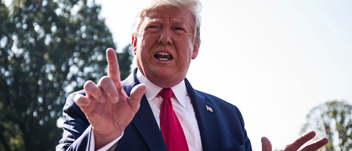 WASHINGTON, DC - AUGUST 07: President Donald Trump speaks to members of the press before departing from the White House en route to Dayton, Ohio and El Paso, Texas on August 7, 2019 in Washington, DC. Trump is will visit the two cities to meet with victims and law enforcement following a pair of deadly shooting attacks last weekend. (Photo by Zach Gibson/Getty Images)