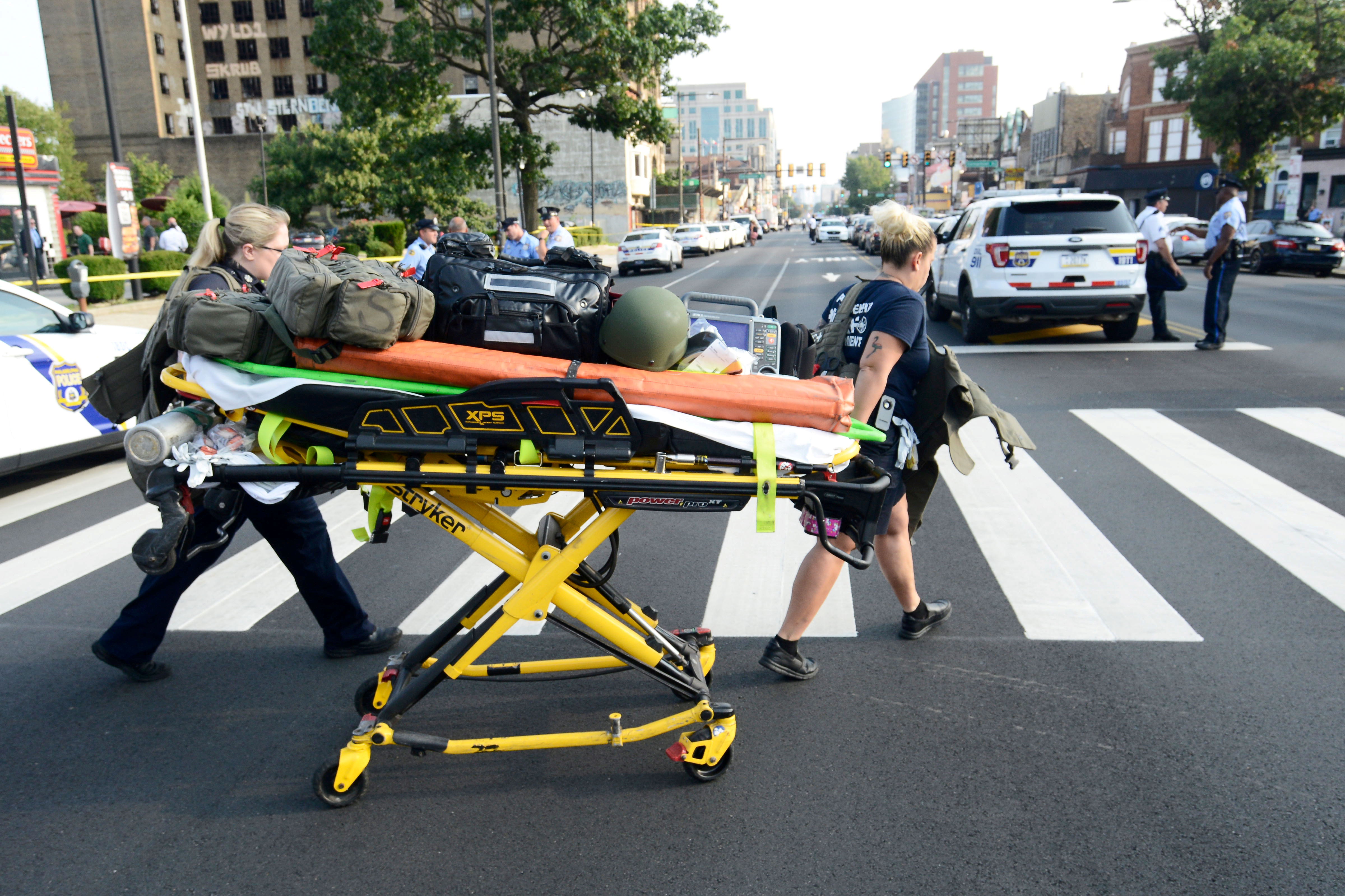 Paramedics roll a stretcher near the scene of a shooting incident in which several police were injured in Philadelphia, Pennsylvania, U.S. August 14, 2019. REUTERS/Bastiaan Slabbers
