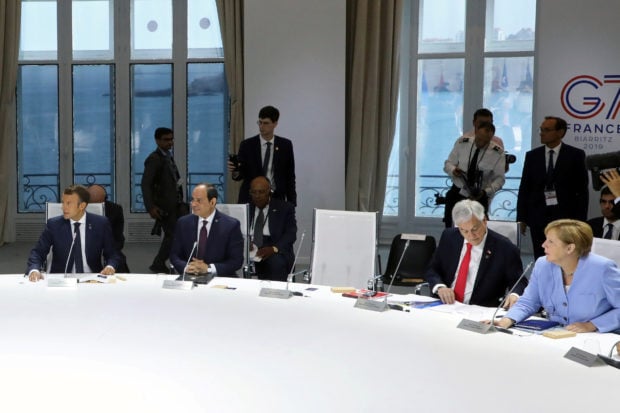 The empty chair of U.S. President Donald Trump is seen during a working session focused on climate change during the G7 Summit in Biarritz, France, August 26, 2019. (Ludovic Marin/Pool via REUTERS)