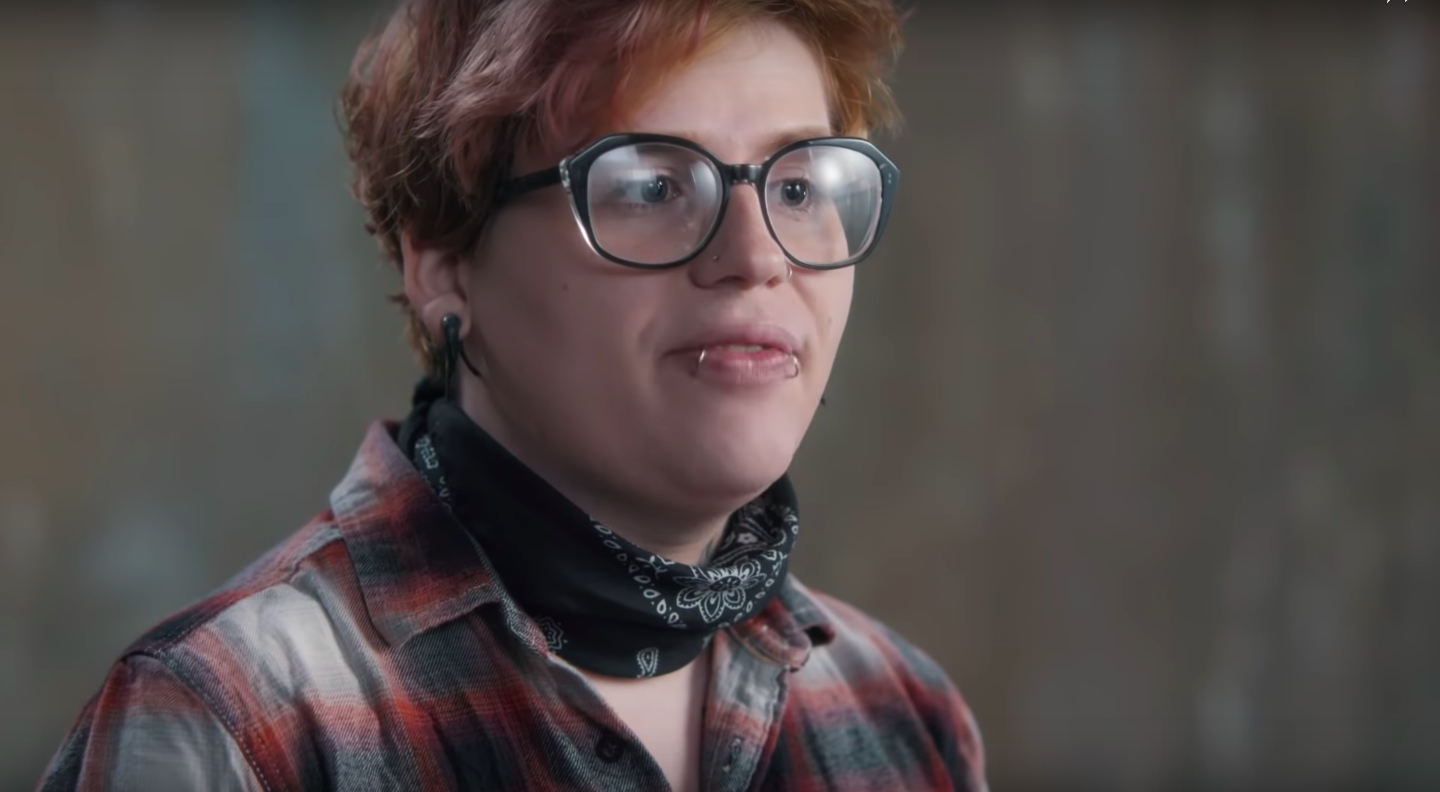 A person appears in a promotional video for MasterCard to promote the True Name card, which allows non-binary and transgender people to use a card that displays a name other than their legal name. (Mastercard/Youtube)