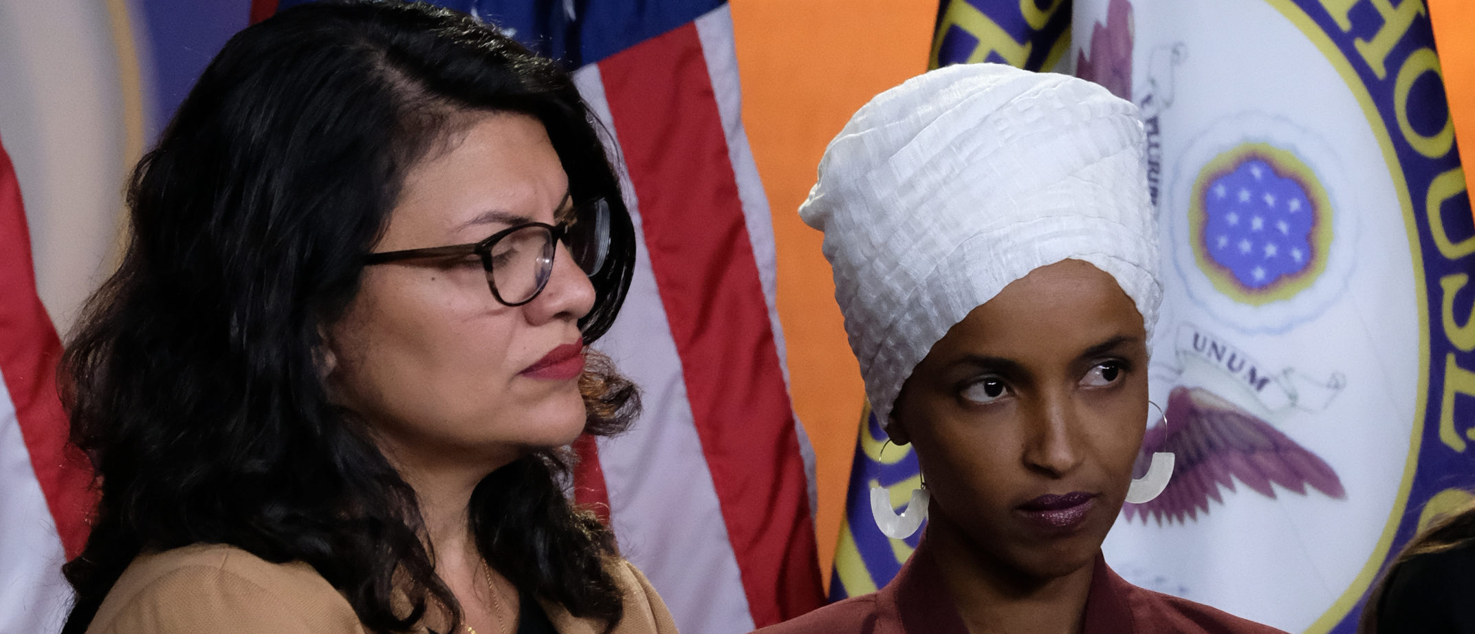 U.S. Reps. Rashida Tlaib, Ilhan Omar and Alexandria Ocasio-Cortez listen during a news conference at the U.S. Capitol on July 15, 2019 in Washington, D.C. (Photo by Alex Wroblewski/Getty Images)