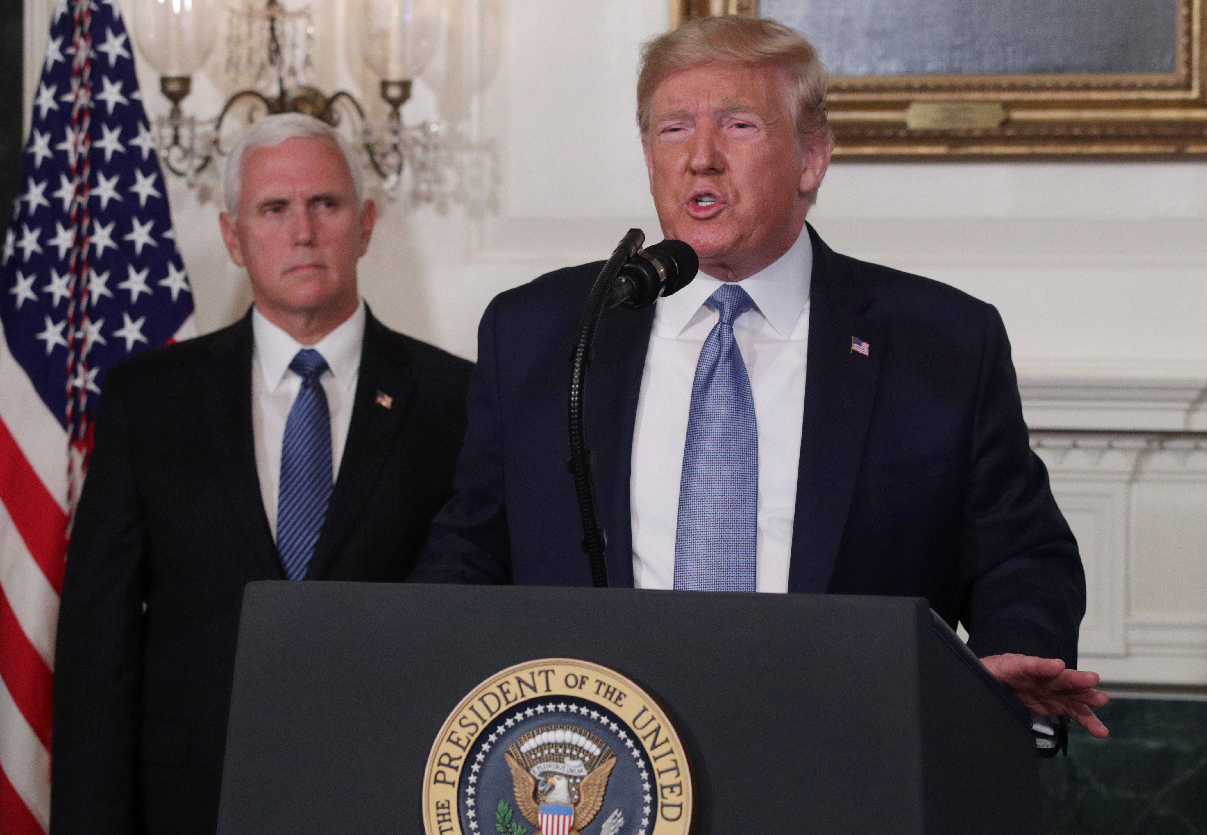 WASHINGTON, DC - AUGUST 05: U.S. President Donald Trump makes remarks in the Diplomatic Reception Room of the White House as U.S. Vice President Mike Pence looks on August 5, 2019 in Washington, DC. President Trump delivered remarks on the mass shootings in El Paso, Texas, and Dayton, Ohio, over the weekend. (Photo by Alex Wong/Getty Images)