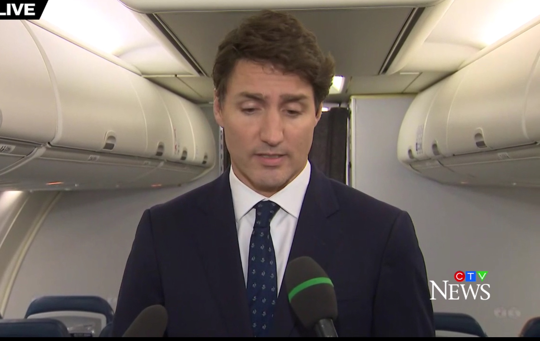 Canadian Prime Minister Justin Trudeau speaks to reporters from his election campaign aircraft. He apologized for wearing brownface, Sept. 18, 2019. CTV News screenshot.