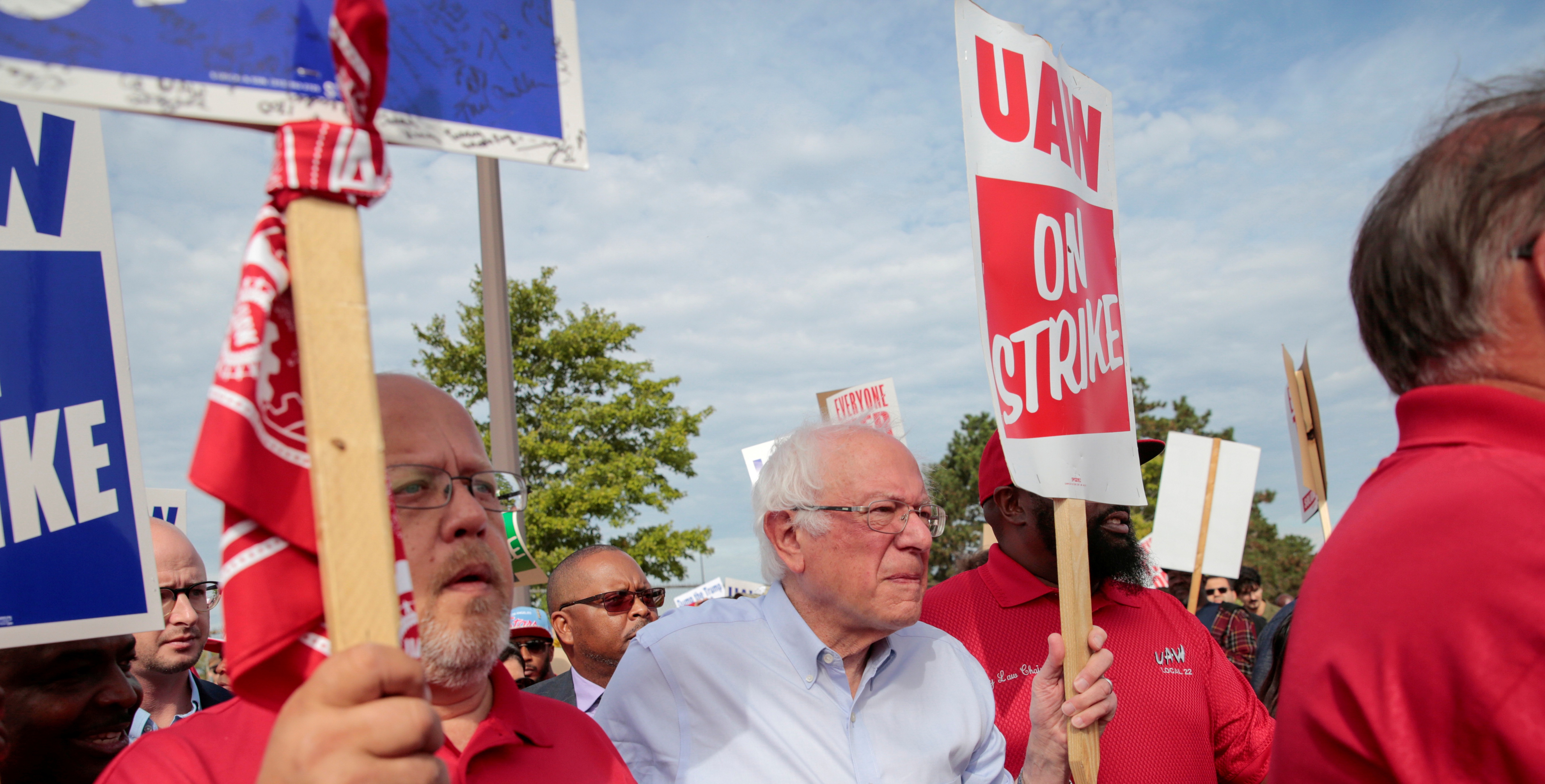 Democratic U.S. presidential candidate Senator Bernie Sanders carries a Strike sign with striking United Auto Workers (UAW) in Hamtramck, Michigan, U.S. September 25, 2019. REUTERS/Rebecca Cook