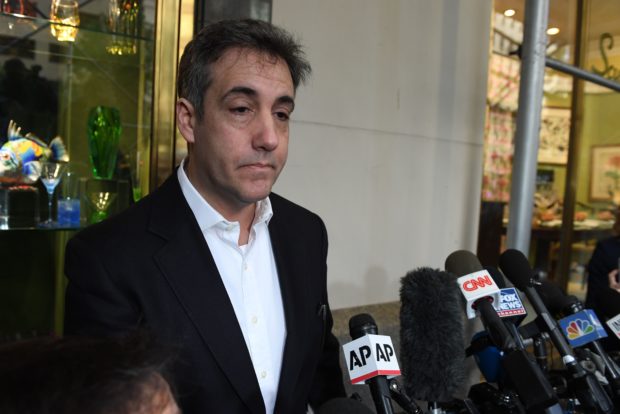 Michael Cohen, the former lawyer for US President Donald Trump, talks to the press as he leaves his Park Avenue apartment May 6, 2019 in New York City to begin serving a three-year sentence at a federal prison in Otisville, New York. (TIMOTHY A. CLARY/AFP/Getty Images)