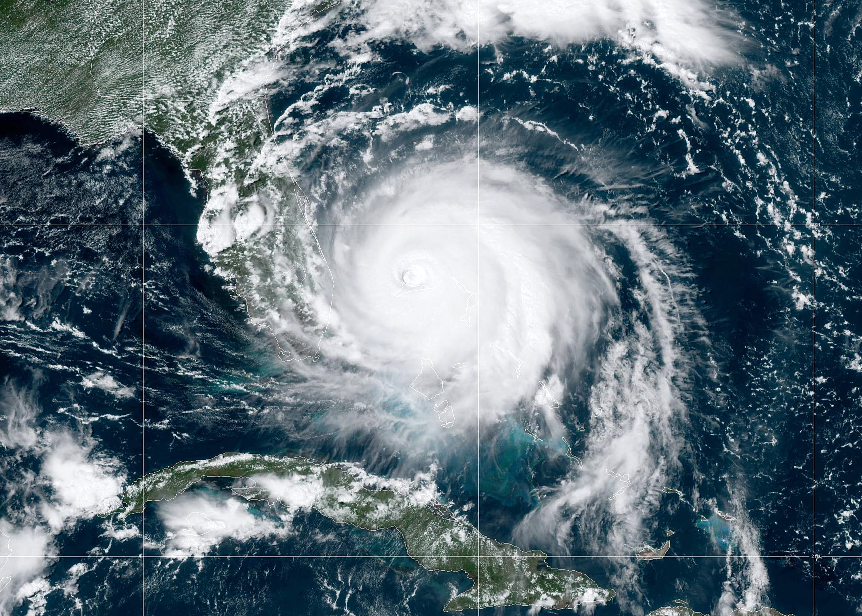 In this NOAA GOES-East satellite handout image, Hurricane Dorian moves slowly past Grand Bahama Island on September 2, 2019. (NOAA/Getty Images)