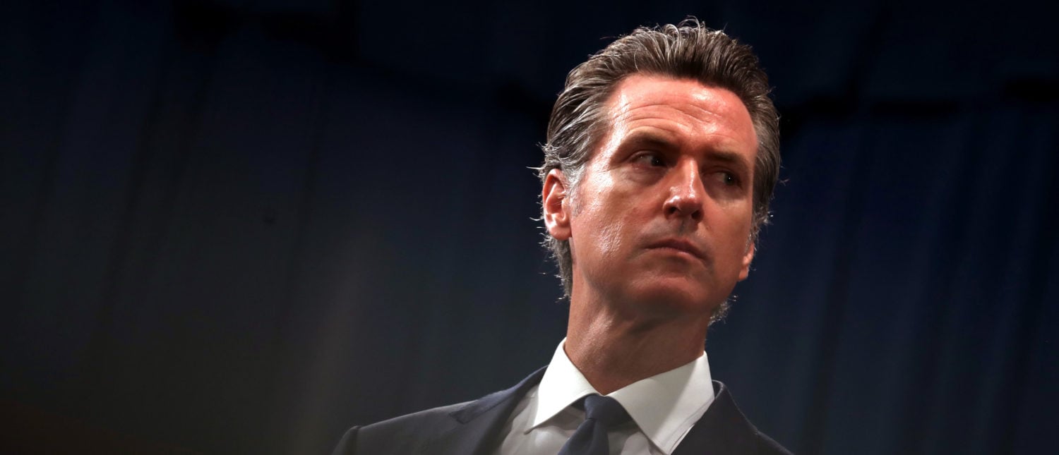 SACRAMENTO, CALIFORNIA - AUGUST 16: California Gov. Gavin Newsom looks on during a news conference with California attorney General Xavier Becerra at the California State Capitol on August 16, 2019 in Sacramento, California. California attorney genera Xavier Becerra and California Gov. Gavin Newsom announced that the State of California is suing the Trump administration challenging the legality of a new "public charge" rule that would make it difficult for immigrants to obtain green cards who receive public assistance like food stamps and Medicaid. (Photo by Justin Sullivan/Getty Images)