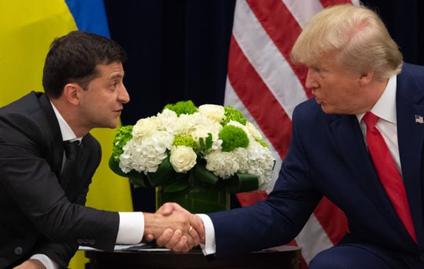 TOPSHOT - US President Donald Trump and Ukrainian President Volodymyr Zelensky shake hands during a meeting in New York on September 25, 2019, on the sidelines of the United Nations General Assembly. (Photo by SAUL LOEB/AFP/Getty Images)