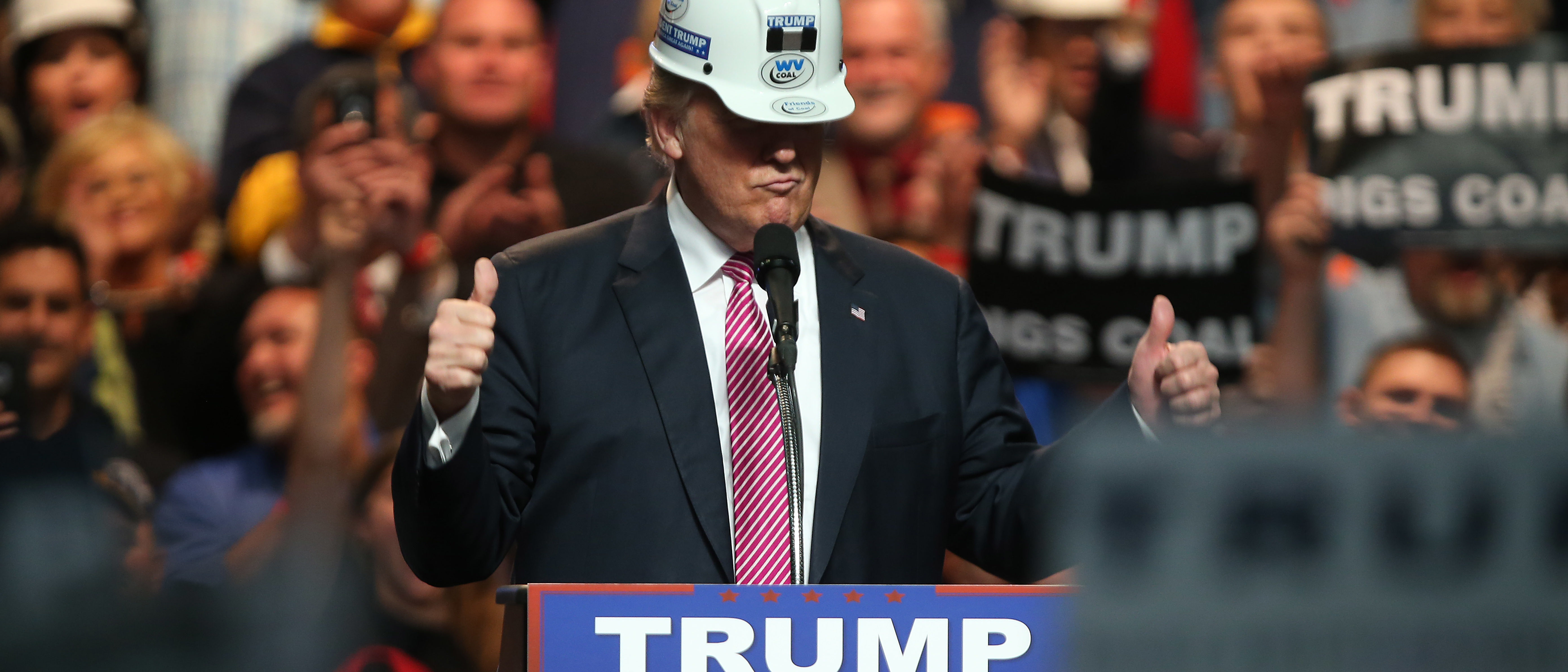 CHARLESTON, WV - MAY 05: Republican Presidential candidate Donald Trump models a hard hat in support of the miners during his rally at the Charleston Civic Center on May 5, 2016 in Charleston, West Virginia. Trump became the Republican presumptive nominee following his landslide win in indiana on Tuesday.(Photo by Mark Lyons/Getty Images)