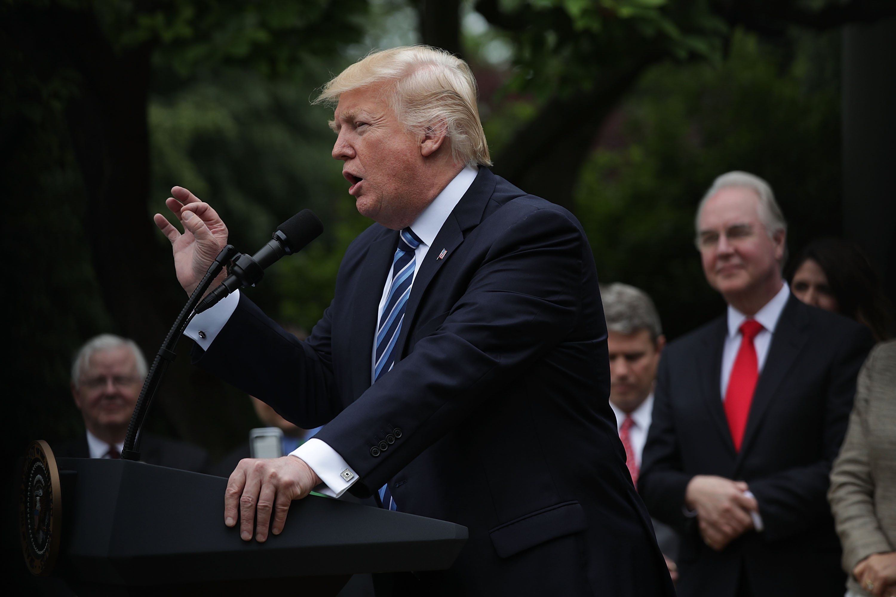 WASHINGTON, DC - MAY 04: U.S. President Donald Trump speaks as Health and Human Services Secretary Tom Price looks on during a Rose Garden event May 4, 2017 at the White House in Washington, DC. The House has passed the American Health Care Act that will replace the Obama era's Affordable Healthcare Act with a vote of 217-213. (Photo by Alex Wong/Getty Images)
