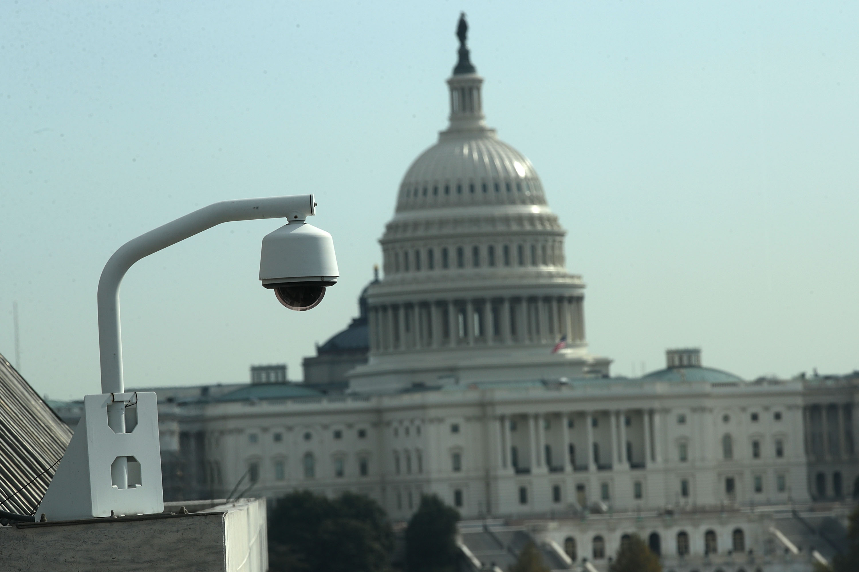 As the U.S. Capitol is seen in the background, a CCTV camera is mounted on a building roof November 3, 2017 in Washington, DC. (Photo by Alex Wong/Getty Images)