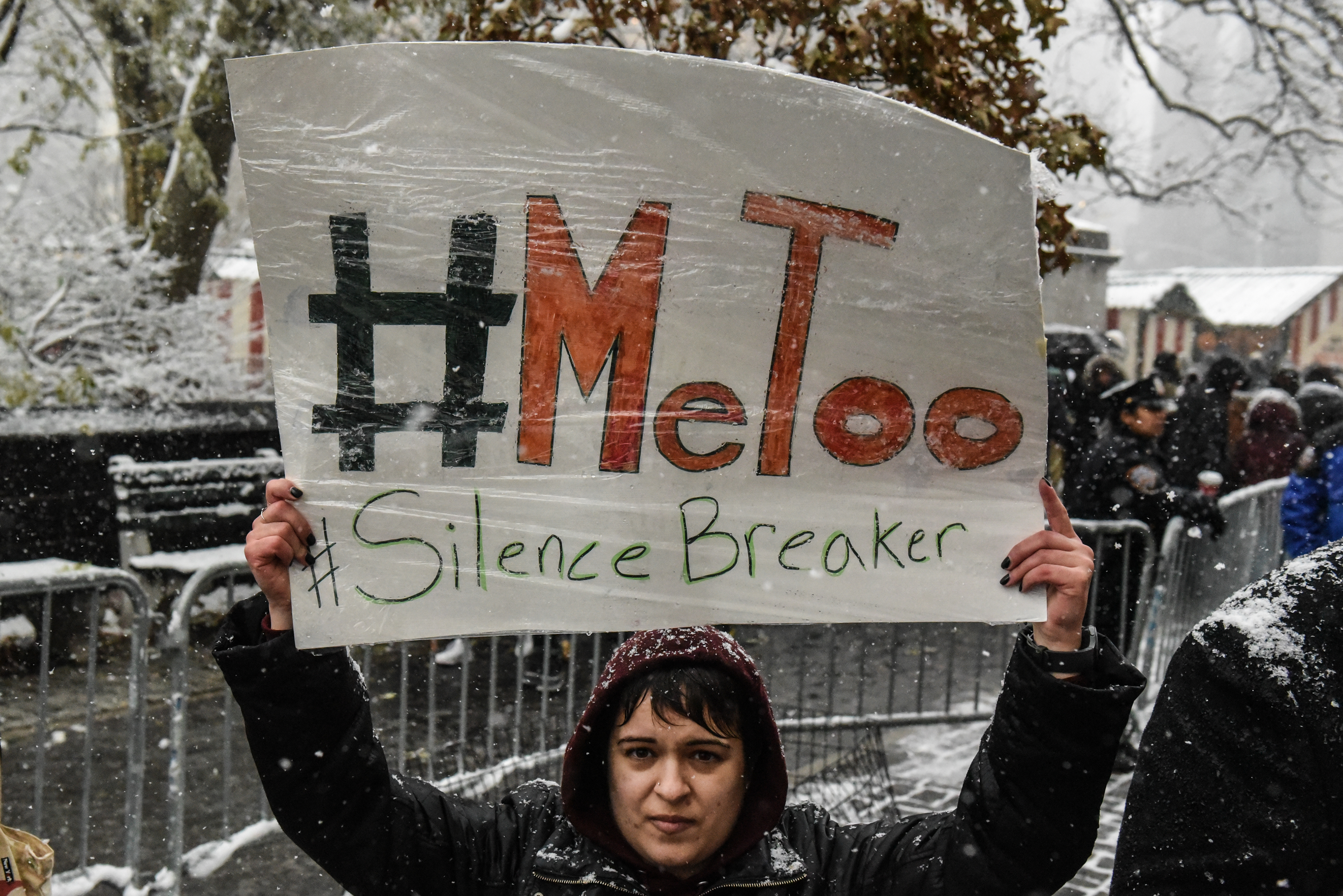 NEW YORK, NY - DECEMBER 09: People carry signs addressing the issue of sexual harassment at a #MeToo rally outside of Trump International Hotel on December 9, 2017 in New York City. (Photo by Stephanie Keith/Getty Images)