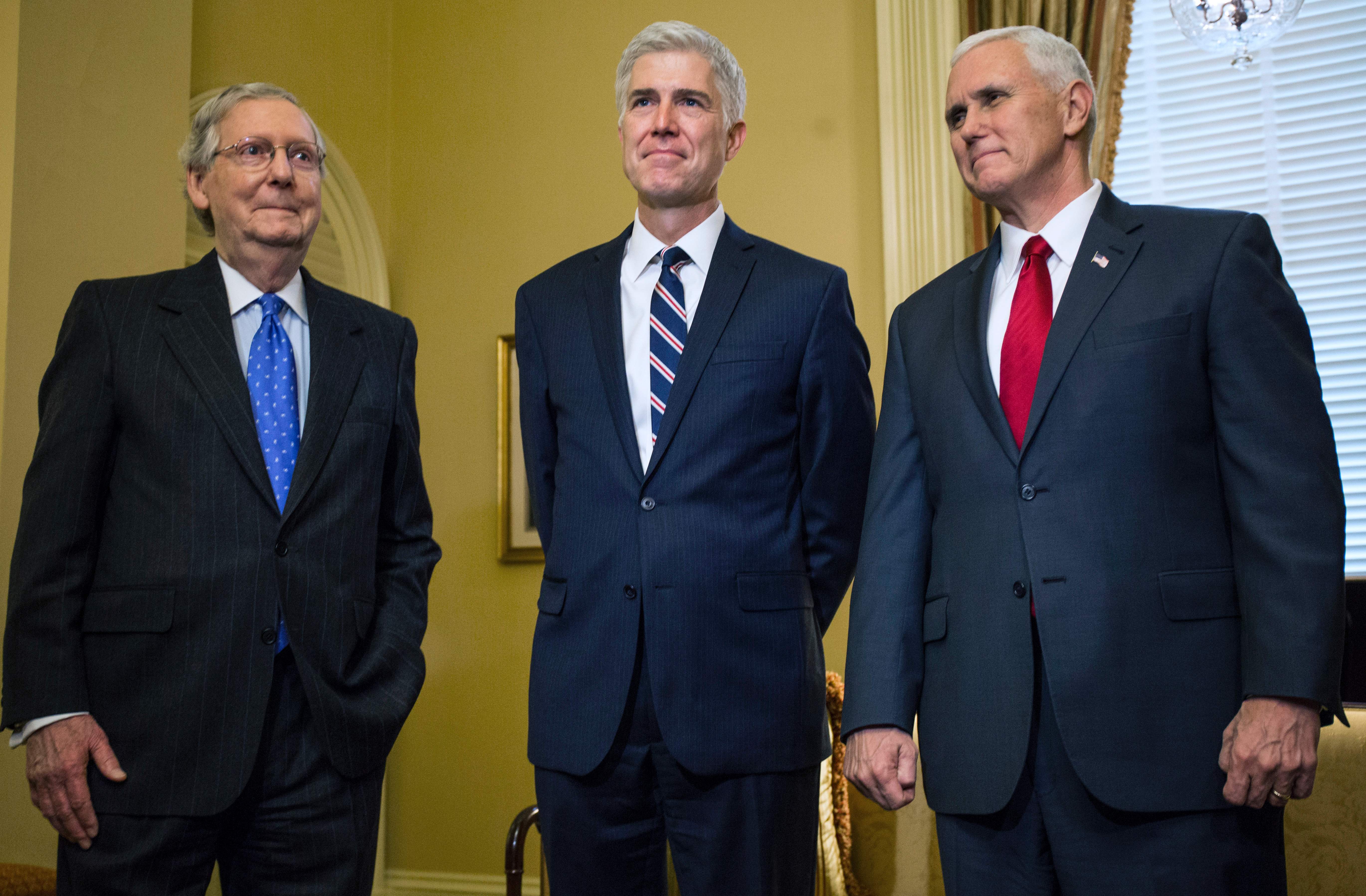 Mitch McConnell (R-KY), Justice Neil Gorsuch, and Vice President Mike Pence on February 1, 2017. (Zach Gibson/AFP/Getty Images)