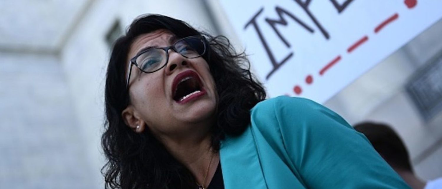 Rep. Rashida Tlaib D-MI joins activists asking for impeachment of US President Trump as they gather on Capitol Hill on September 23, 2019 in Washington,DC. - The demonstration and press event was to demand the House of Representatives to take urgent and immediate action towards impeaching US President Donald Trump. (Photo: BRENDAN SMIALOWSKI/AFP/Getty Images)