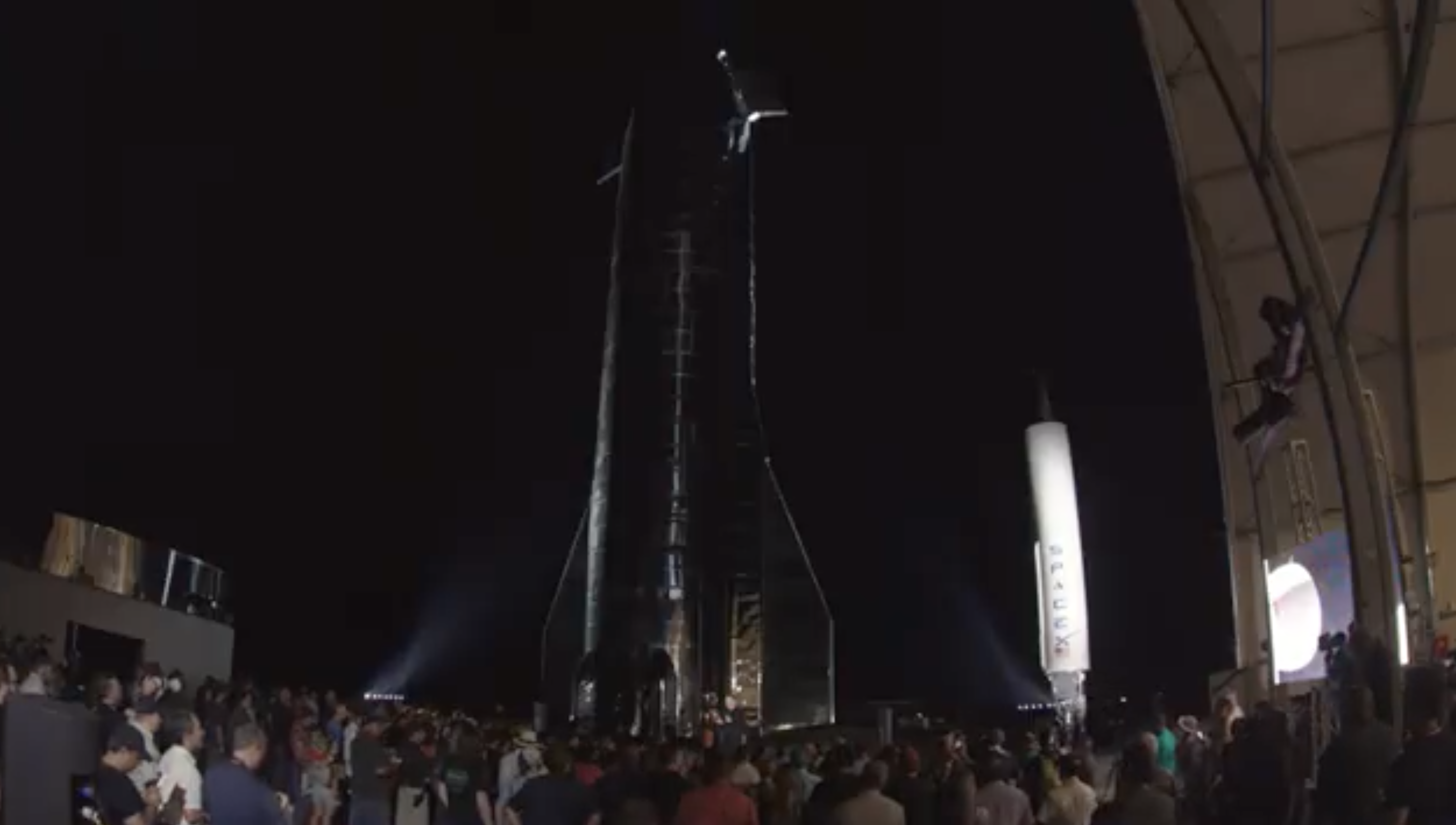 Elon Musk stands in front of SpaceX's Starship and gives an update on the breakthrough project's process. (Screenshot Livestream, Space.com)