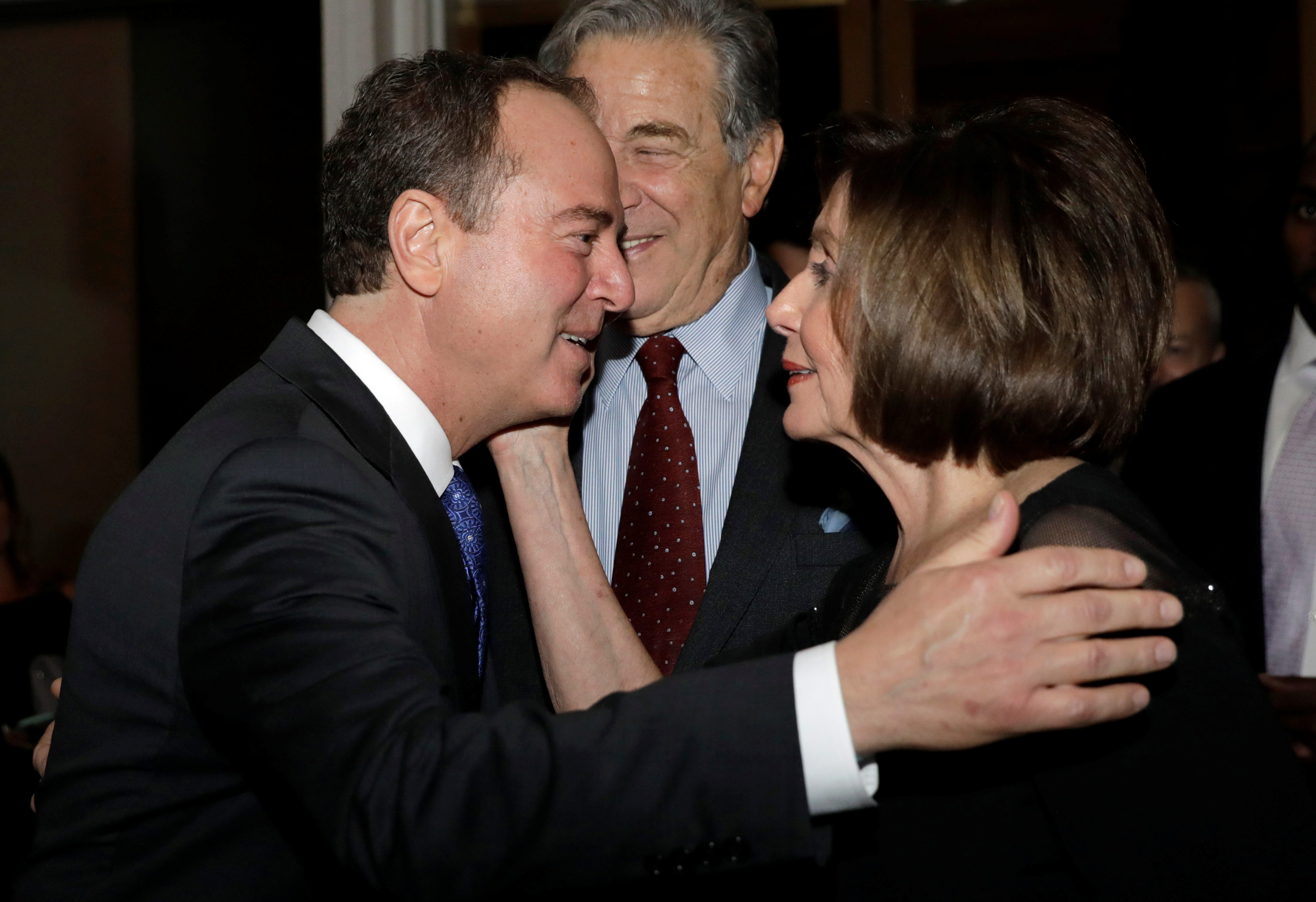 U.S. House Speaker Nancy Pelosi (D-CA) and Congressman Adam Schiff (D-CA) hug as they arrive ahead of comedian Dave Chappelle receiving the Mark Twain Prize for American Humor at the Kennedy Center in Washington, U.S., October 27, 2019. REUTERS/Yuri Gripas