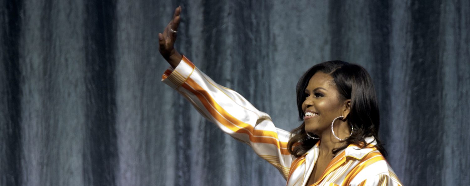 Former first lady Michelle Obama waves on stage at the AccorHotels Arena during a book tour to promote her memoir "Becoming" in Paris, France, April 16, 2019. REUTERS/Charles Platiau