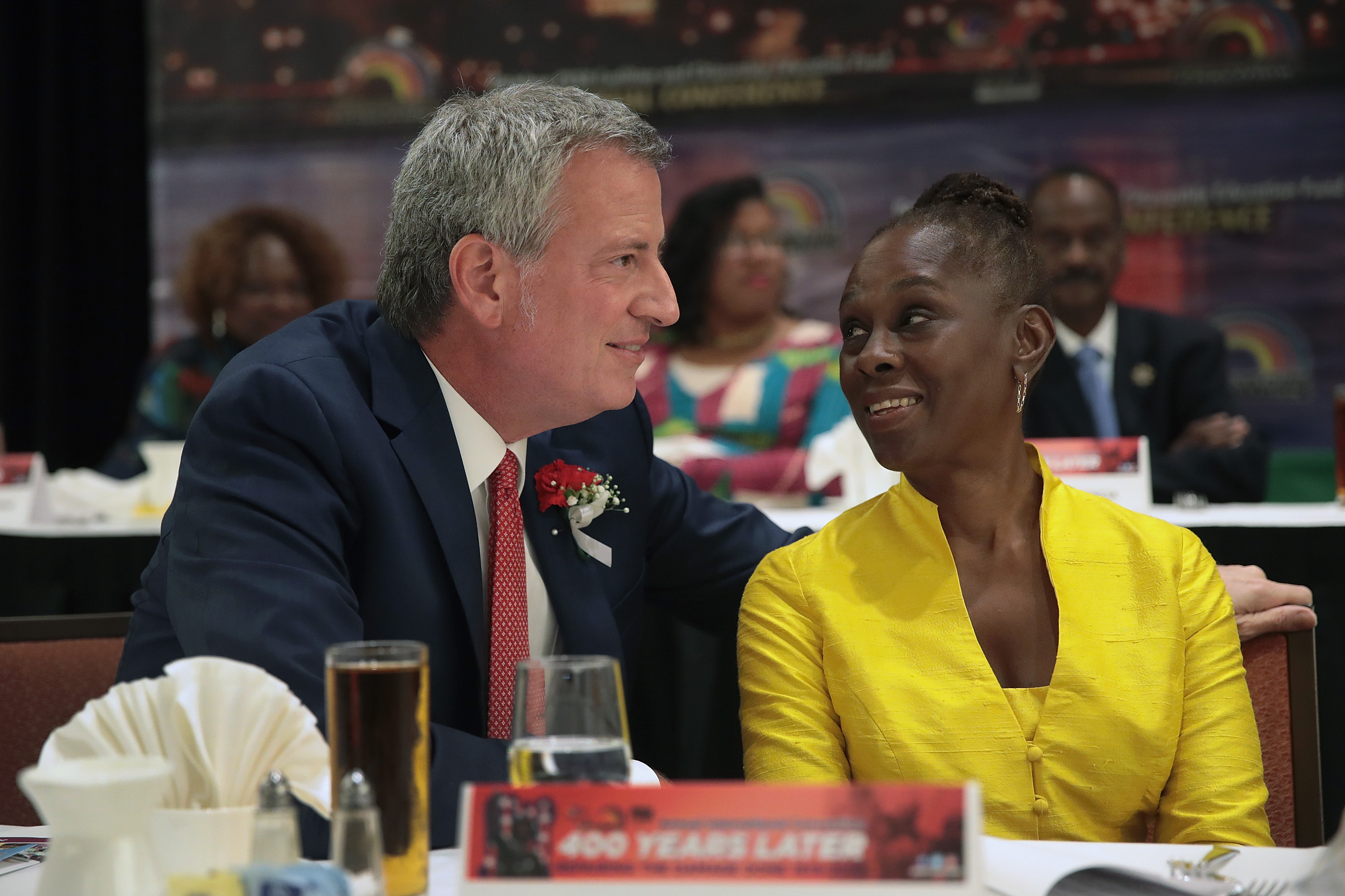 Democratic presidential candidate and New York City mayor Bill De Blasio speaks to his wife Chirlane McCray at the Rainbow PUSH Coalition Annual International Convention on July 1, 2019 in Chicago, Illinois. (Scott Olson/Getty Images)