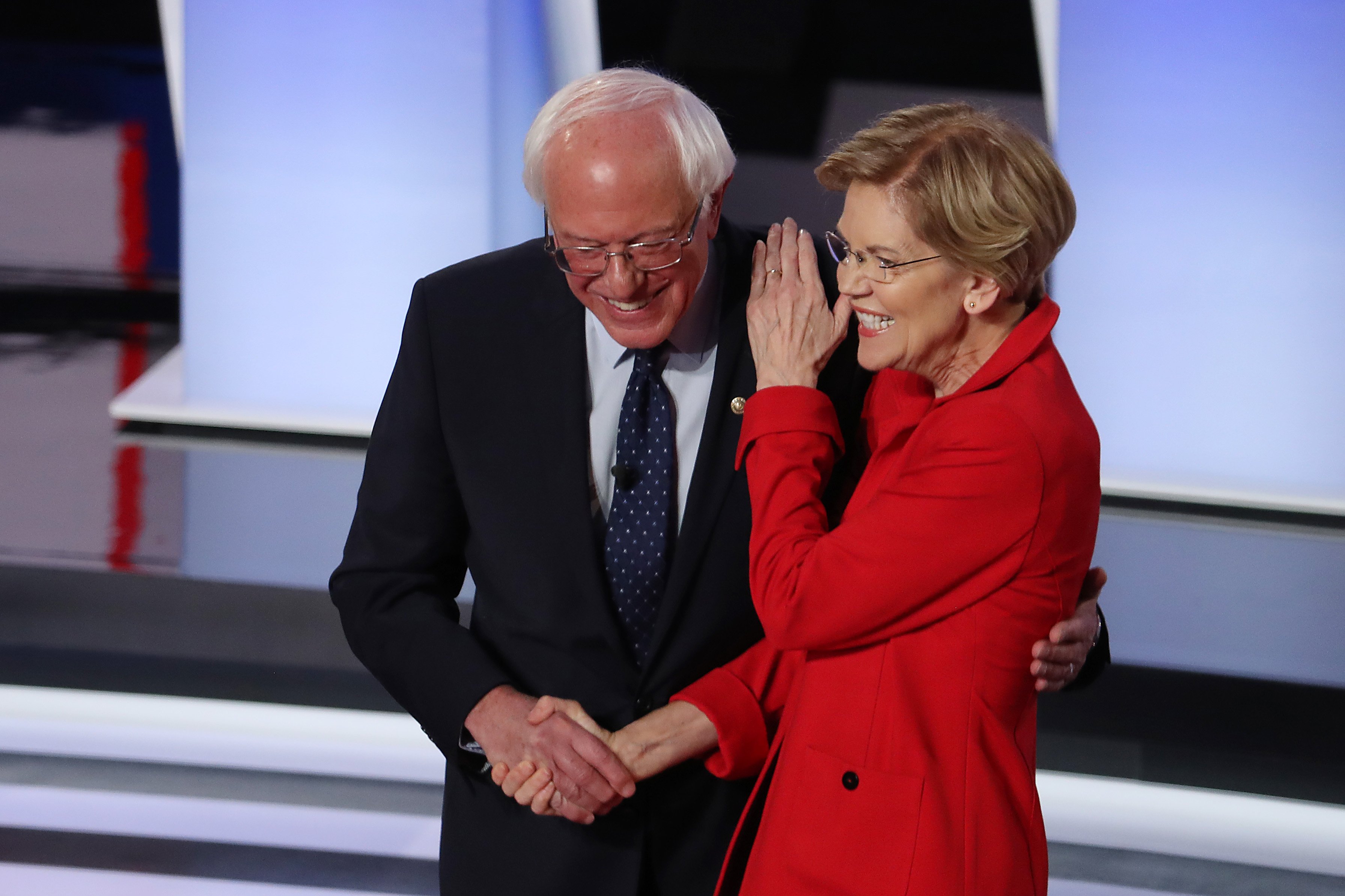 DETROIT, MICHIGAN - JULY 30: Democratic presidential candidate Sen. Bernie Sanders (I-VT) (R) and Sen. Elizabeth Warren (D-MA) greet each other at the start of the Democratic Presidential Debate at the Fox Theatre July 30, 2019 in Detroit, Michigan. 20 Democratic presidential candidates were split into two groups of 10 to take part in the debate sponsored by CNN held over two nights at Detroit’s Fox Theatre. (Photo by Justin Sullivan/Getty Images)