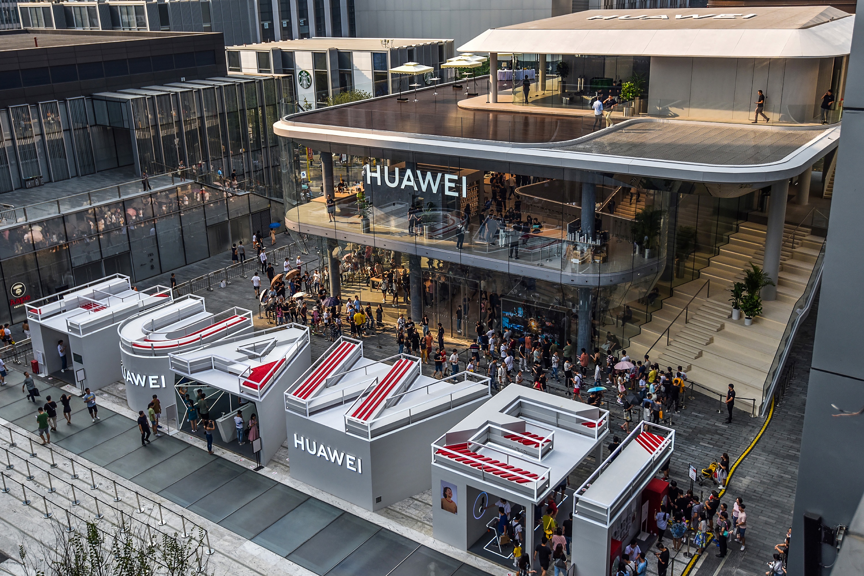 This aerial photo taken on September 28, 2019 shows people visiting a newly-opened Huawei flagship store in Shenzhen in China's southern Guangdong province. (Photo by STR / AFP) / China OUT (Photo credit should read STR/AFP/Getty Images)