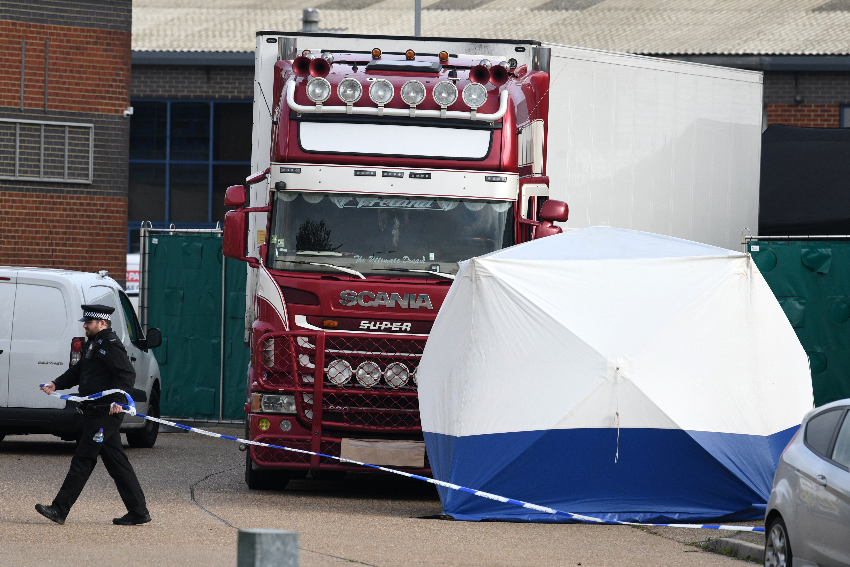 Police stand guard at the site where 39 bodies were discovered in the back of a lorry on October 23, 2019 in Thurrock, England. (Leon Neal/Getty Images)