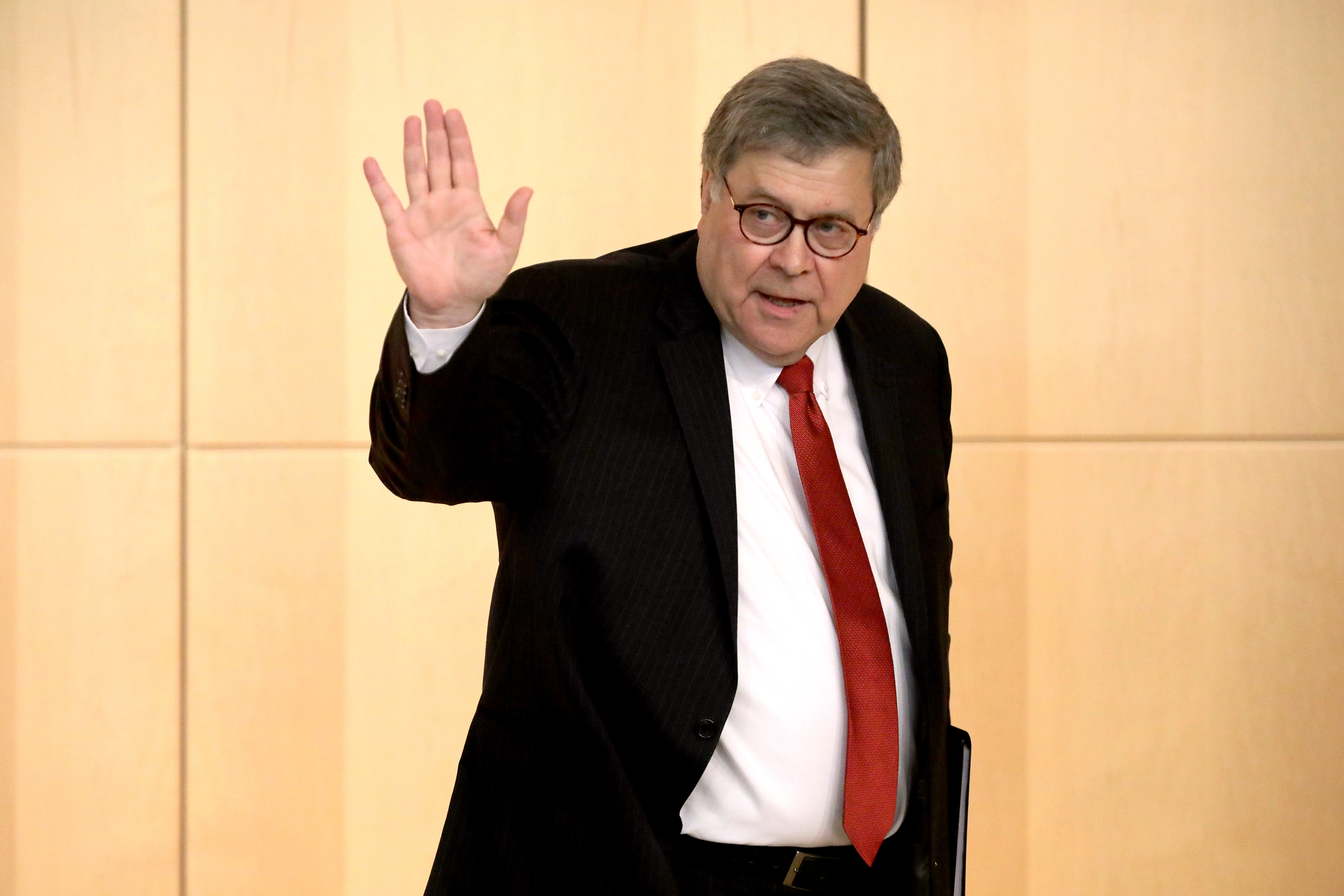 WASHINGTON, DC - OCTOBER 03: U.S. Attorney General William Barr waves goodbye after delivering remarks during the Criminal Coordination Conference at the Securities and Exchange Commission October 03, 2019 in Washington, DC. Barr reportedly traveled to Rome last week to meet with Italian intelligence officers as part of President Donald Trump’s efforts to discredit the investigation into Russian meddling in the 2016 United States election. (Photo by Chip Somodevilla/Getty Images)