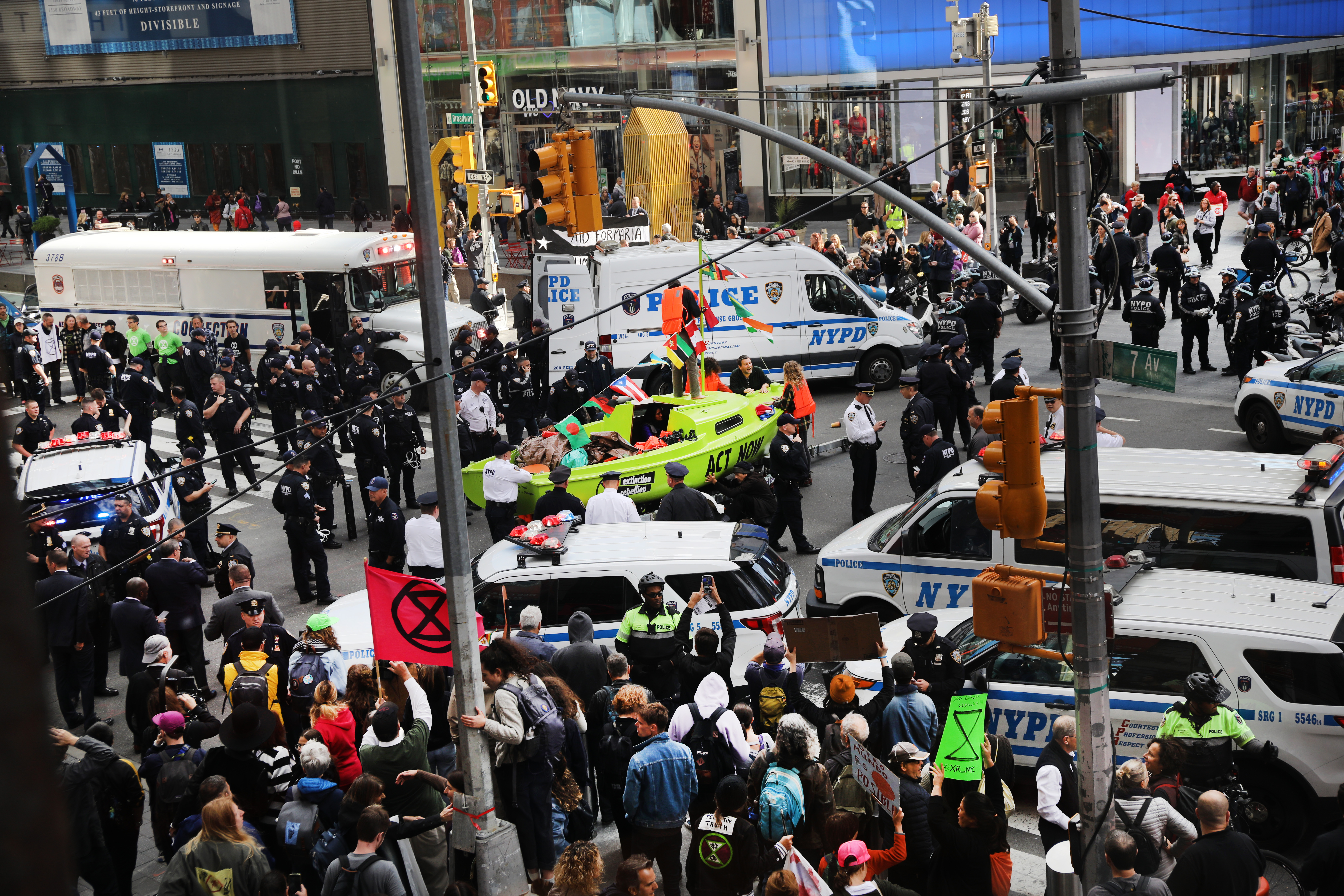 NEW YORK, NEW YORK - OCTOBER 10: Police gather around a small sailboat that was dropped off in Times Square as part of a protest by the environmental group Extinction Rebellion on October 10, 2019 in New York City. As tourists and New Yorkers watched, dozens of people were arrested as the climate change protesters blocked traffic in the busy center of Manhattan. The group is protesting climate change all week throughout the New York City and numerous other locations around the world. (Photo by Spencer Platt/Getty Images)