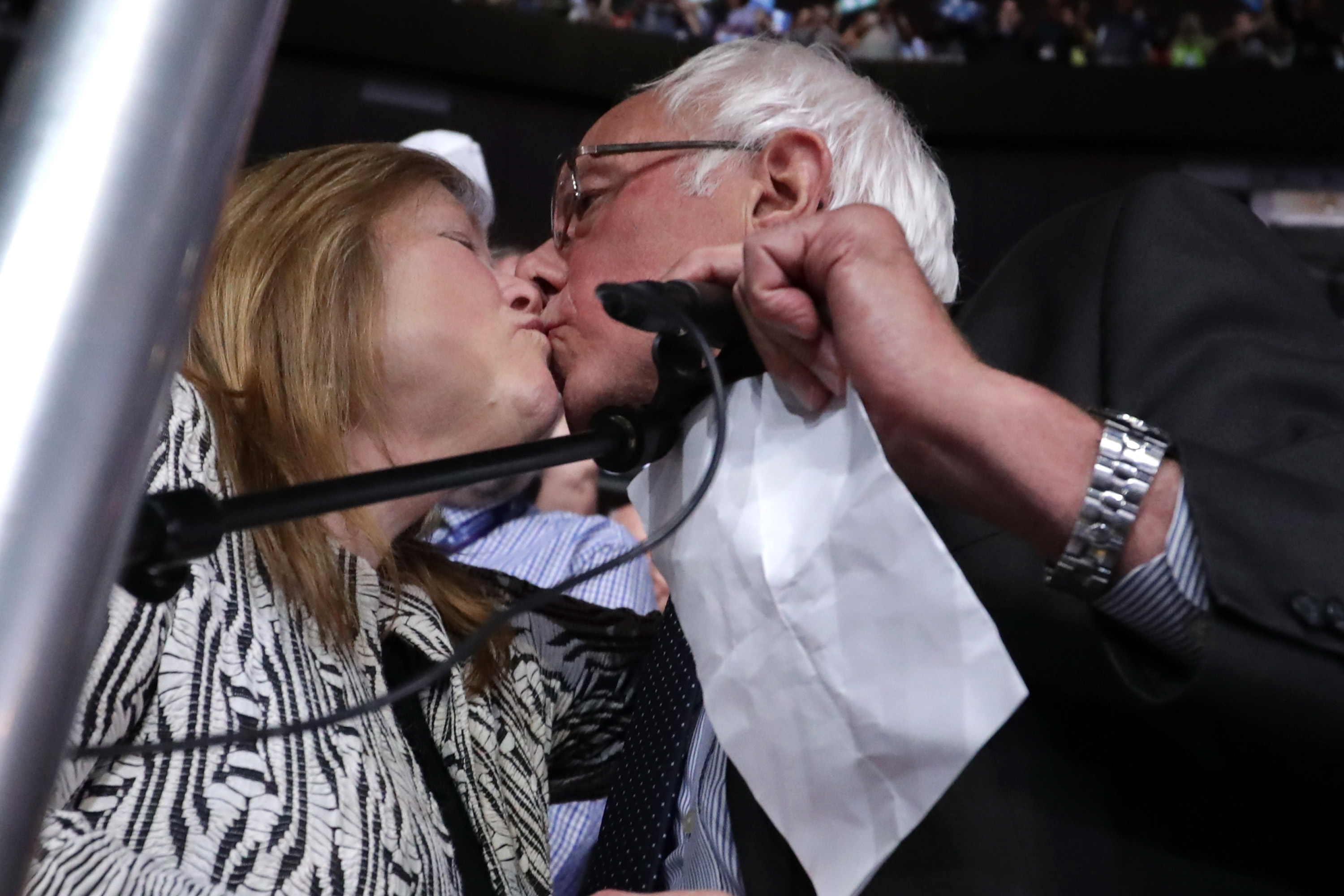 PHILADELPHIA, PA - JULY 26: Sen. Bernie Sanders kisses his wife Jane O'Meara Sanders after the Vermont delegation cast their votes during roll call on the second day of the Democratic National Convention at the Wells Fargo Center, July 26, 2016 in Philadelphia, Pennsylvania. Democratic presidential candidate Hillary Clinton received the number of votes needed to secure the party's nomination. An estimated 50,000 people are expected in Philadelphia, including hundreds of protesters and members of the media. The four-day Democratic National Convention kicked off July 25. (Photo by Chip Somodevilla/Getty Images)