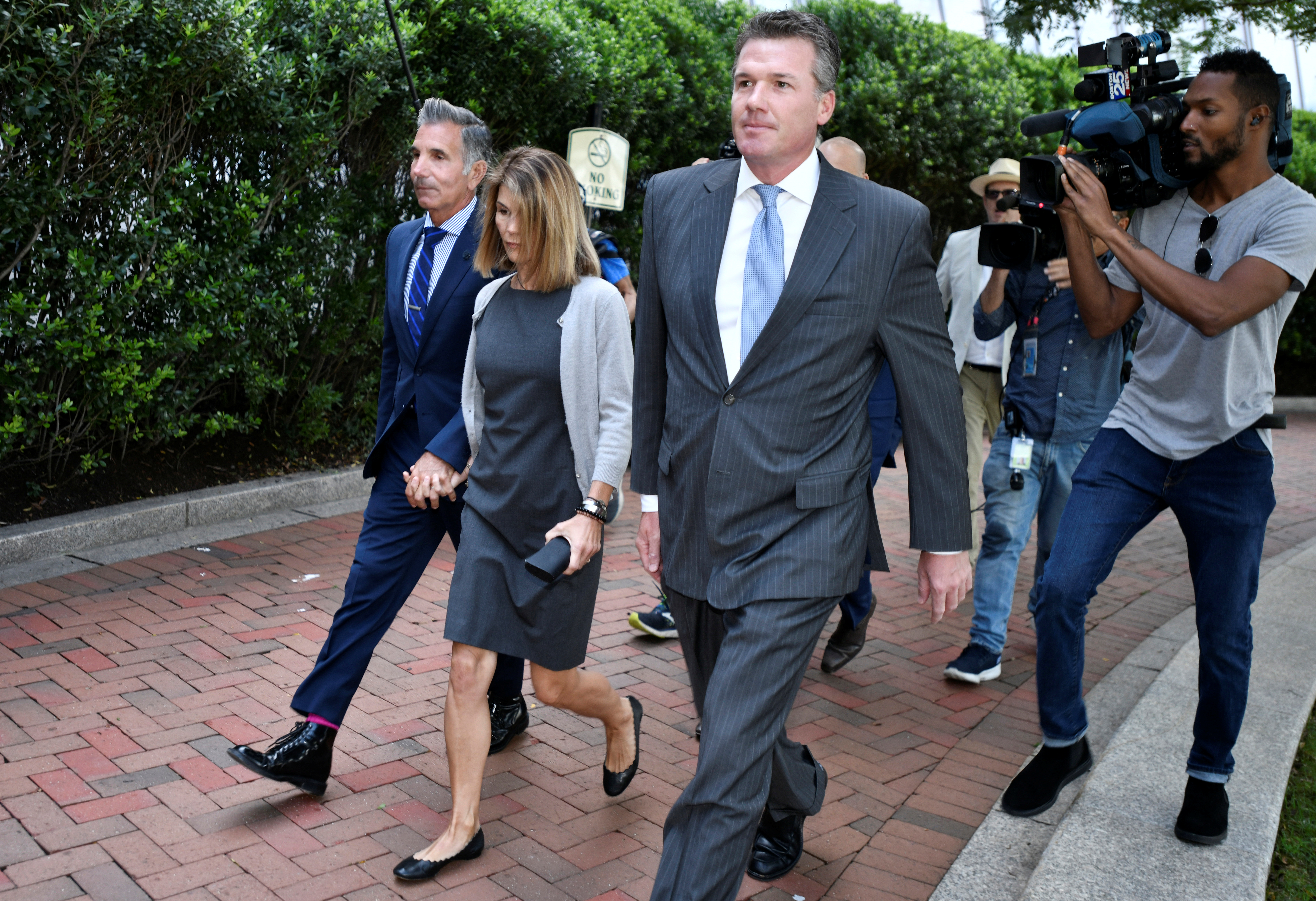Actress Lori Loughlin and her husband, fashion designer Mossimo Giannulli, arrive at the federal courthouse for a hearing on charges in a nationwide college admissions cheating scheme in Boston, Massachusetts, U.S., August 27, 2019. REUTERS/Josh Reynolds