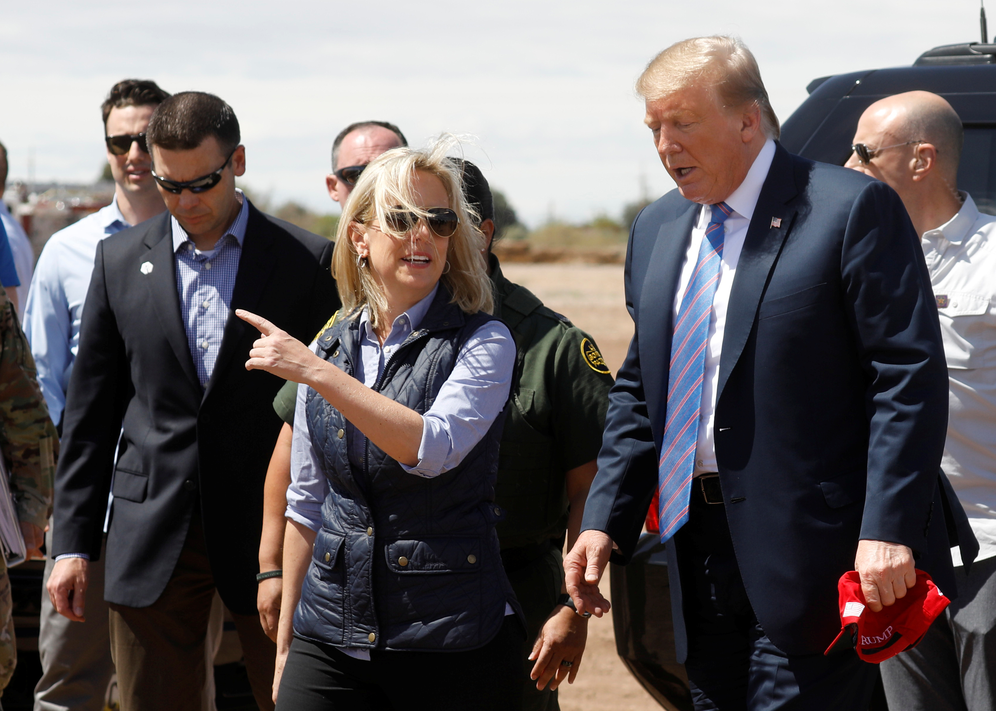 Nielsen and McAleenan walk with Trump at border security tour in California