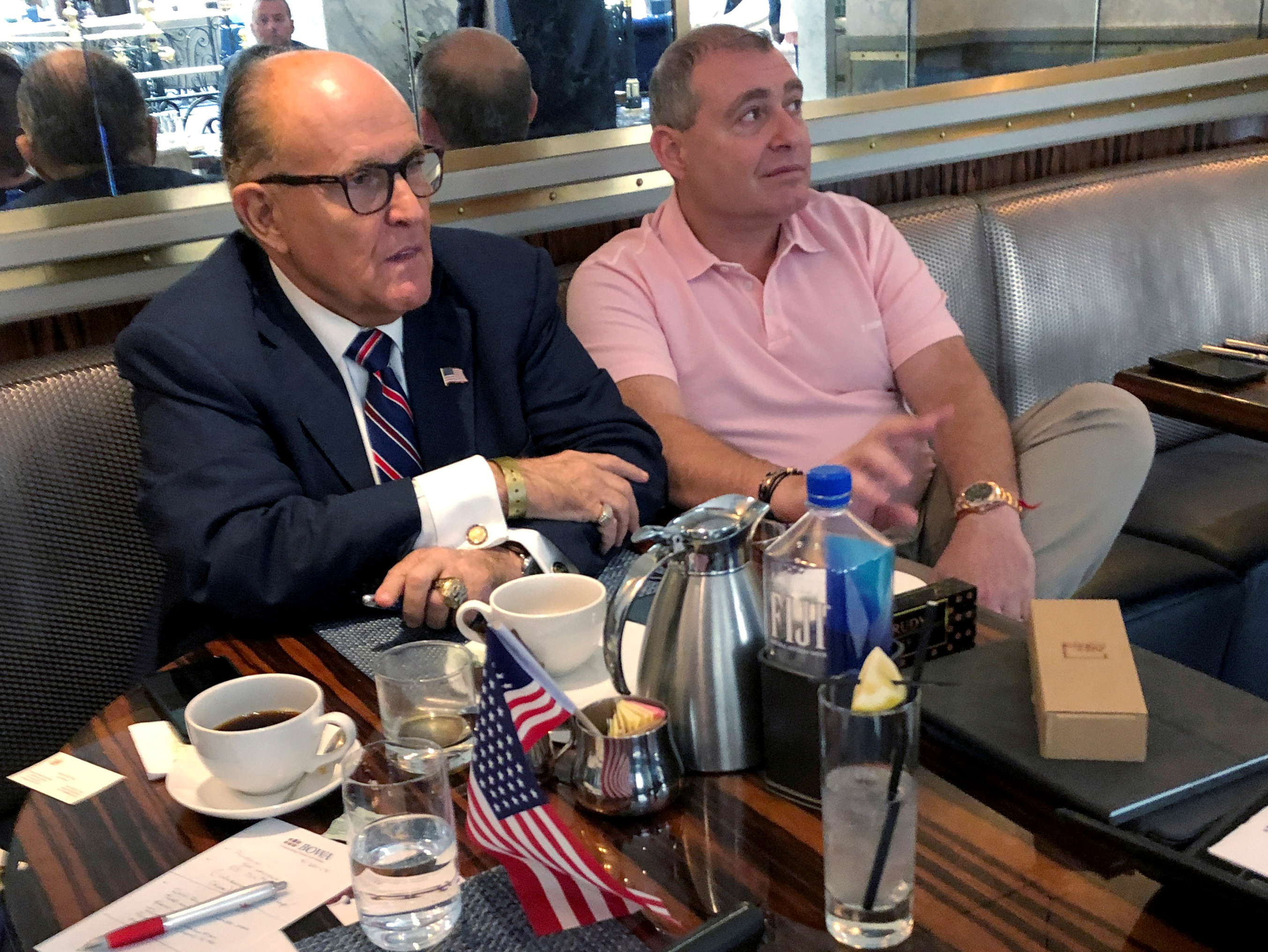 U.S. President Donald Trump's personal lawyer Rudy Giuliani has coffee with Ukrainian-American businessman Lev Parnas at the Trump International Hotel in Washington, U.S. September 20, 2019. (REUTERS/Aram Roston/File Photo)