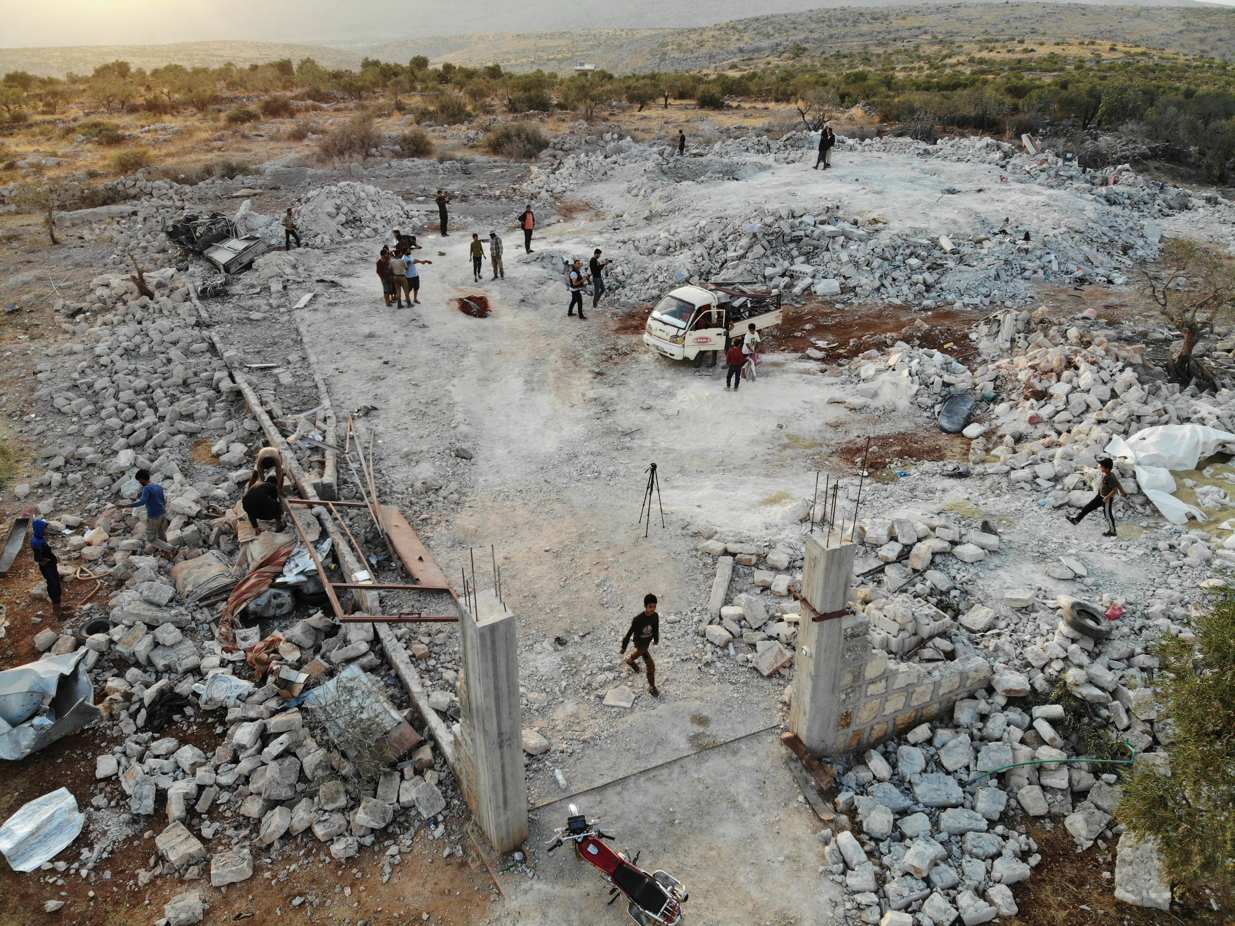 An aerial view taken on October 27, 2019 shows the site that was hit by helicopter gunfire which reportedly killed nine people near the northwestern Syrian village of Barisha in the Idlib province along the border with Turkey, where "groups linked to the Islamic State (IS) group" were present, according to a Britain-based war monitor with sources inside Syria. (OMAR HAJ KADOUR/AFP via Getty Images)